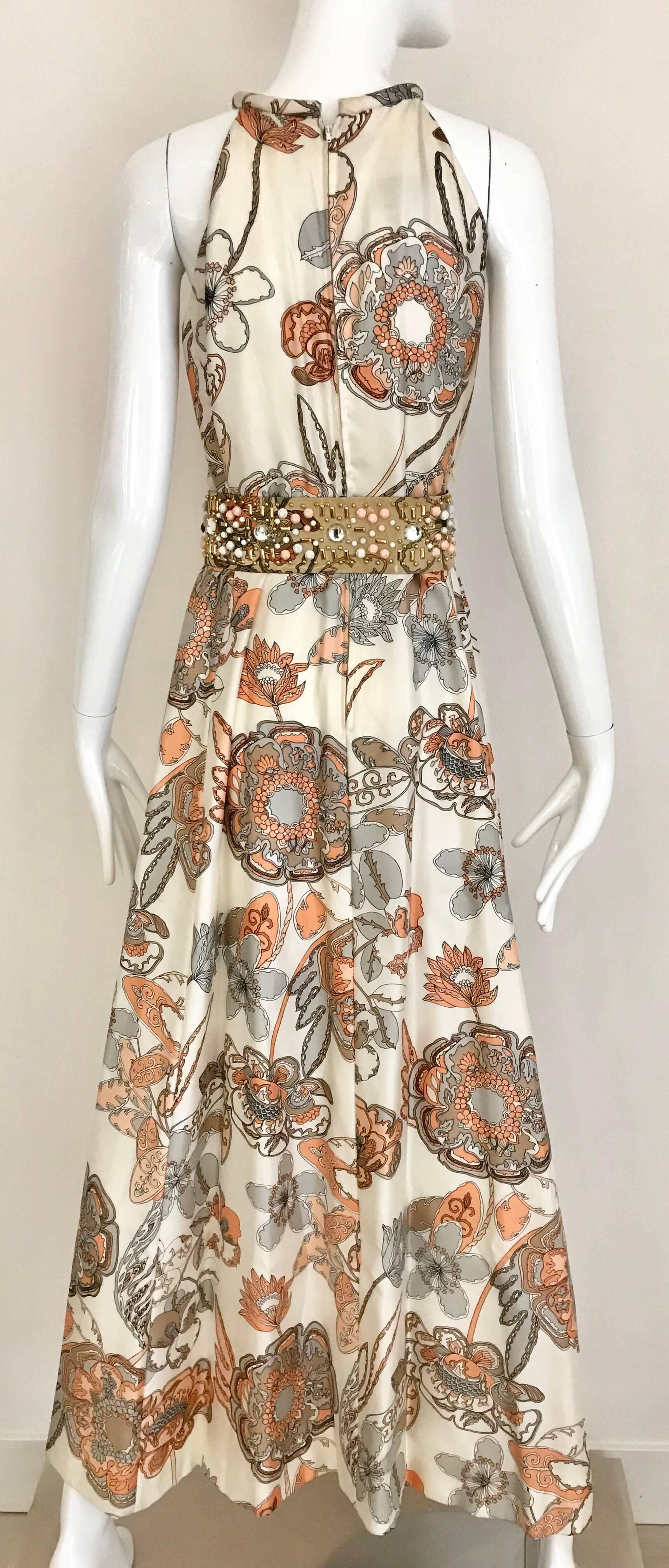 Elegant 1970s Sleeveless silk  Malcolm Starr Creme and Peach Floral Print Silk Dress with Jeweled belt. Size Small/ 2-4
Bust: 34