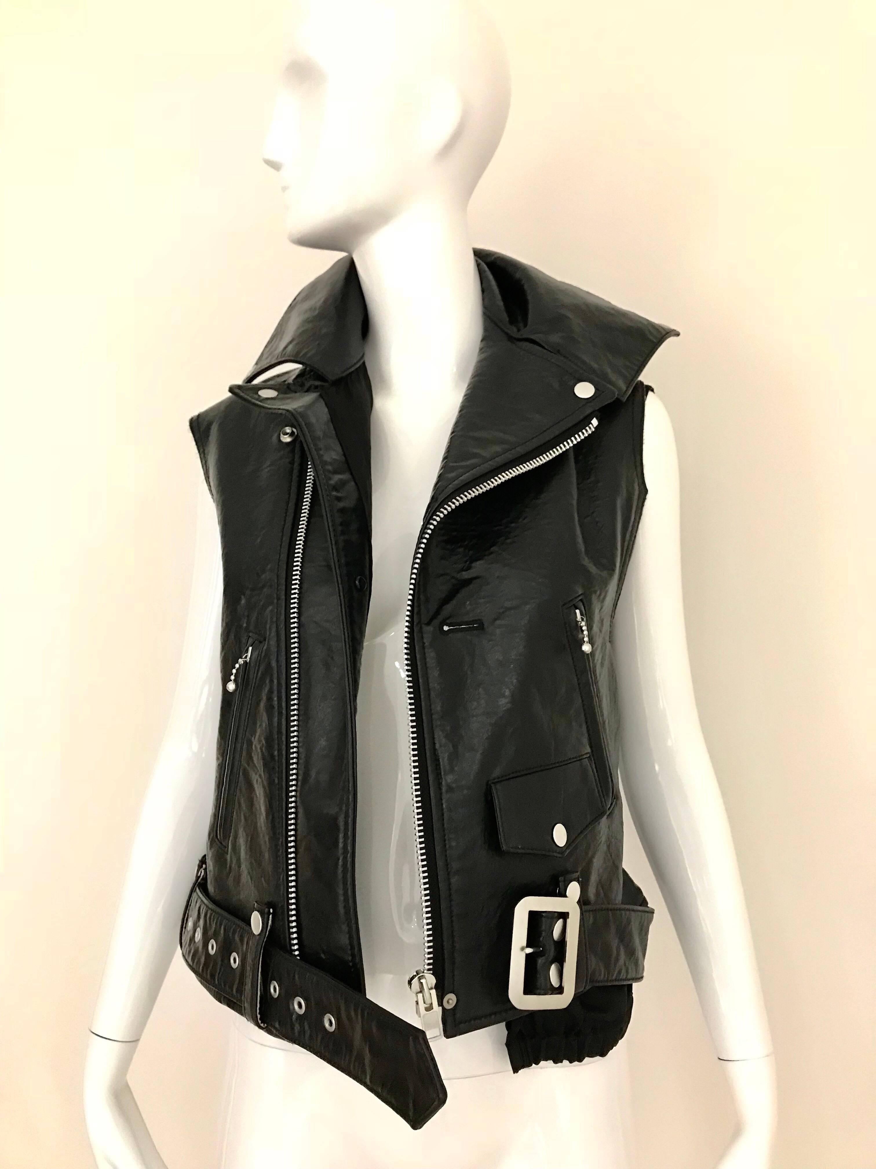 Junya Watanabe Comme des Garcons Avant Garde Black japaDeconstructed Leather Vest with zipper and belt.
Marked size: small. fit US 2/4/6