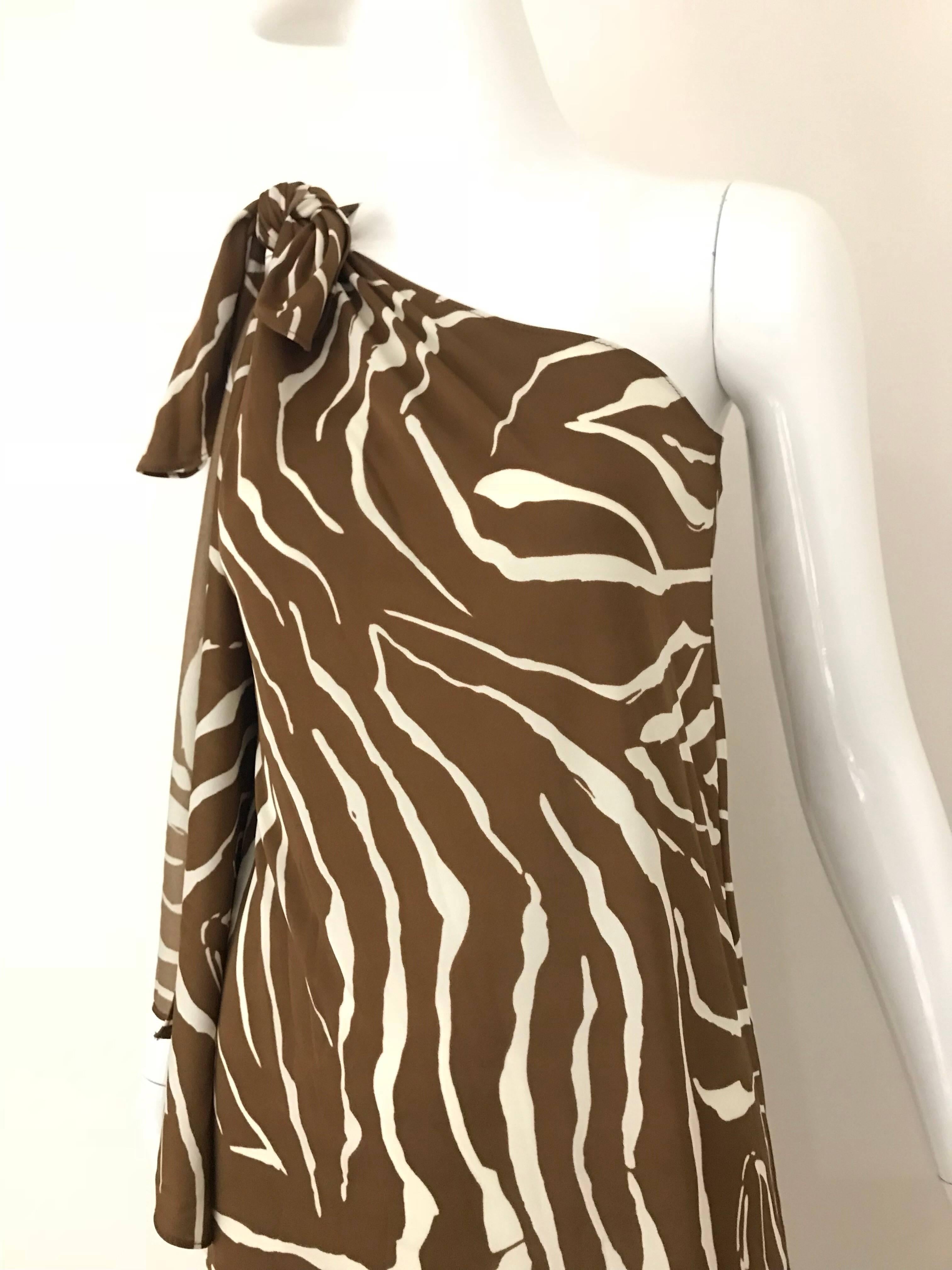 Vintage 1970s Bill Tice Jersey Brown and White Zebra print one shoulder knit dress.
Size Medium / 6