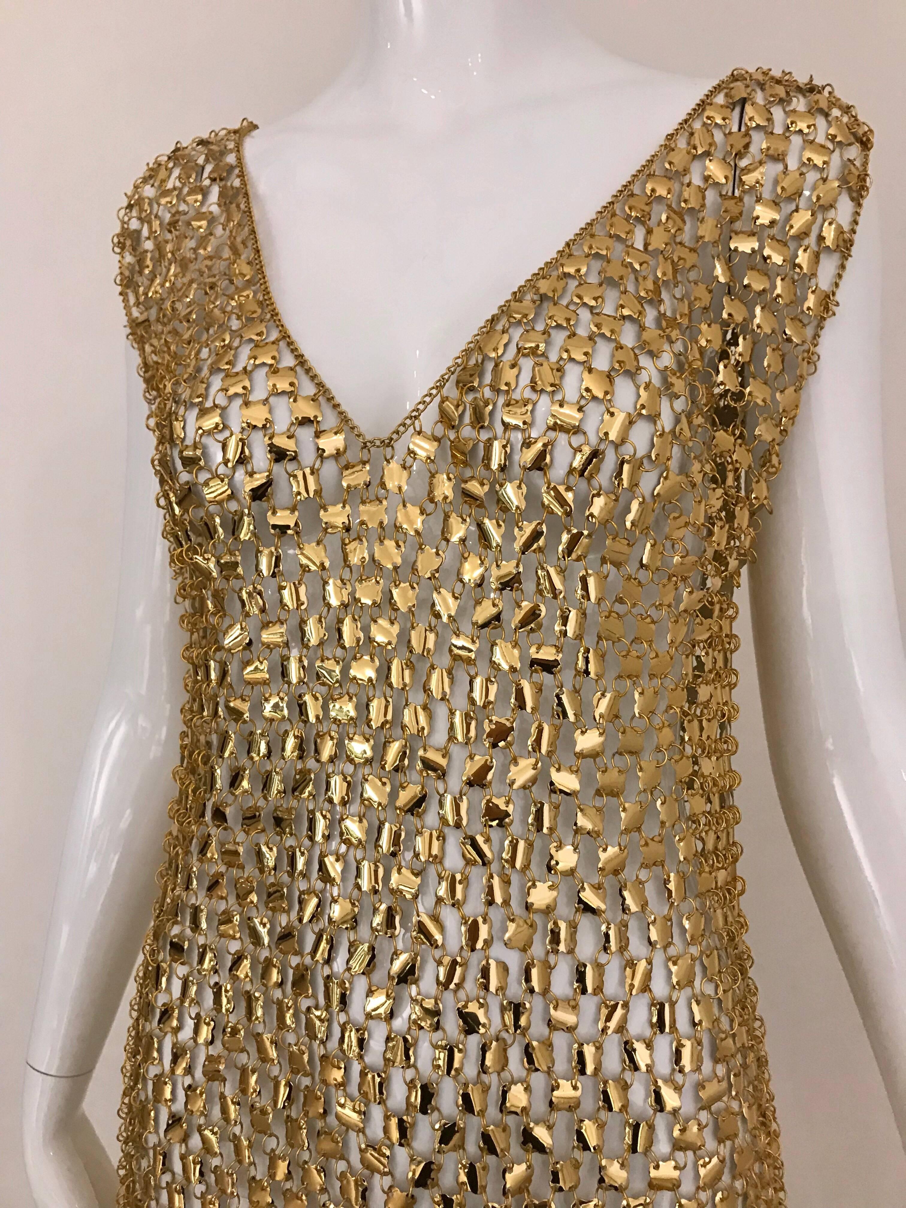Sexy Paco Rabanne aluminum chain mail v neck maxi dress . Perfect for studio 54 party. Dress is very light. You can dance around with it! Slip on dress.
Size: This piece fit size 2/4/6/8