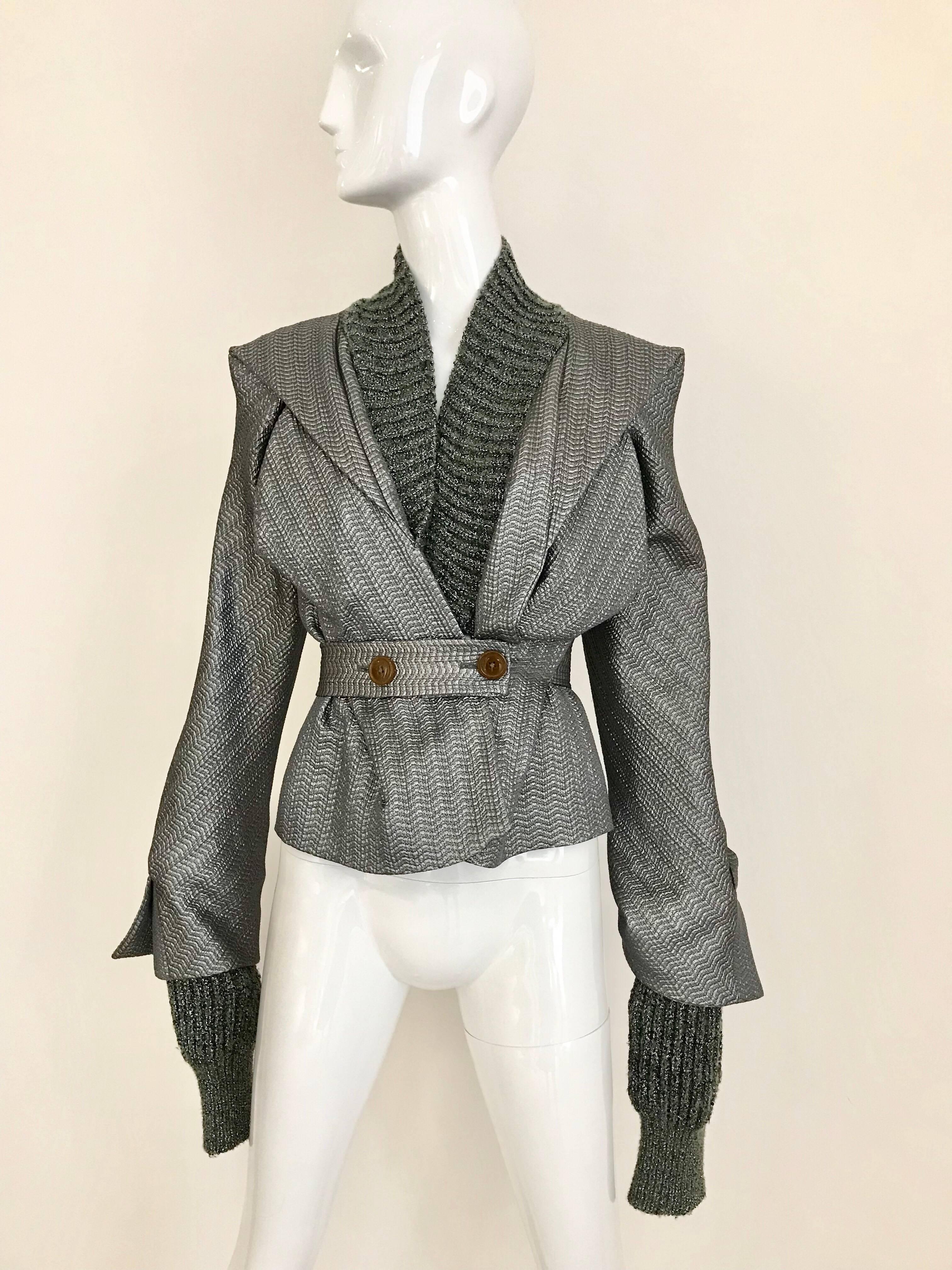 Incredible Vivienne Westwood Metallic Silver Grey and Dark Green Knit jacket.
Collar and Sleeves has combination of Knit and lurex fabric. Exaggerated longer sleeves so you can fold.  Best fit US size Small /2 
Bust: 32