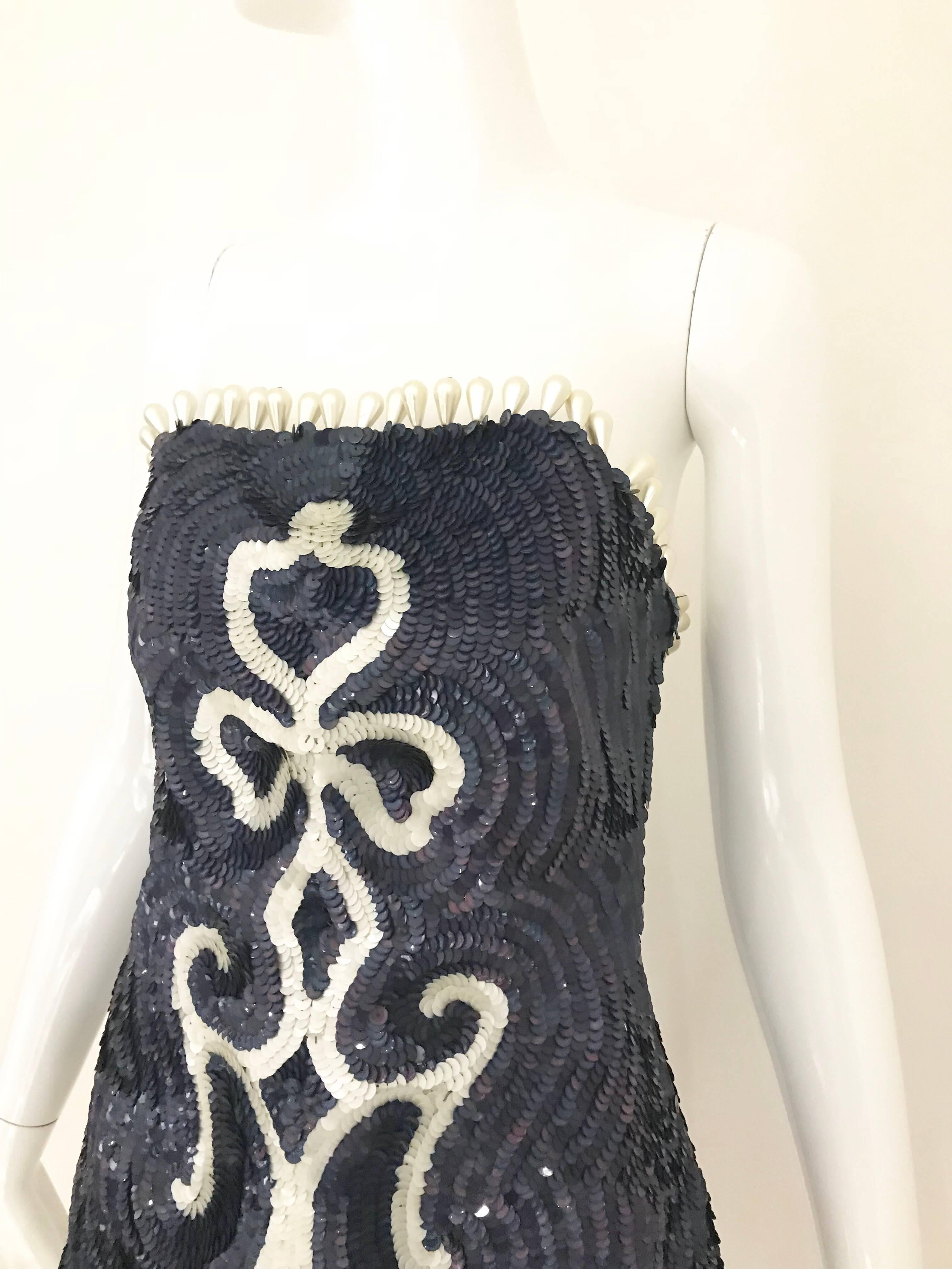 Runway 2014  Maison Martin Margiela Blue and White sequins strapless bustier top with large pearls.
Zip on the side. Marked size 40. Fit us 4
