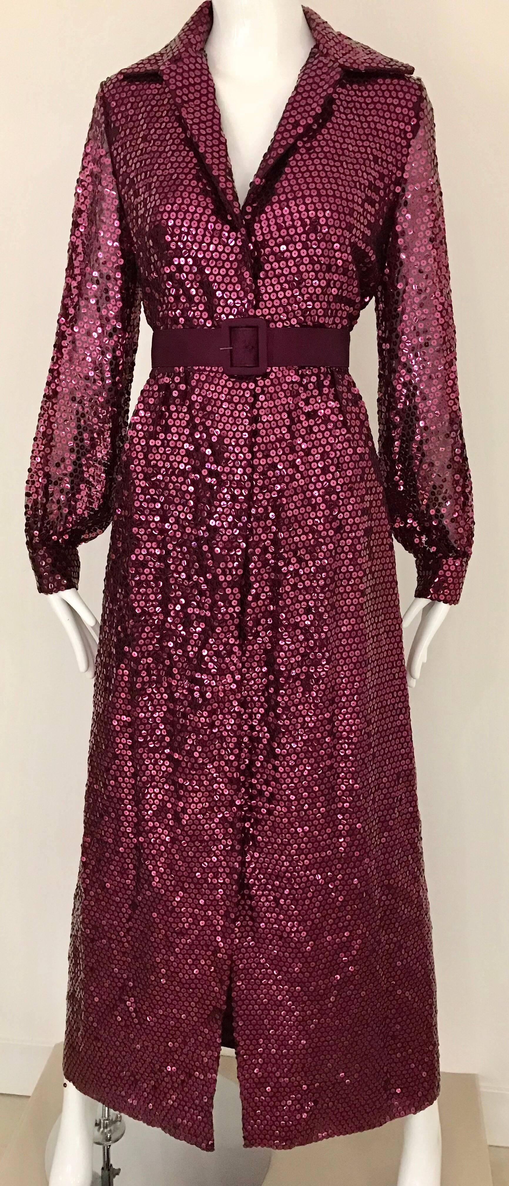 This  Vintage Oscar de LaRenta sequined maxi shirt dress wears “two" hats.
If you button it to the top it gives a more conservative look, or unbutton it a bit and create a provocative “plunging”  look.  Either way you have classic “Oscar” good