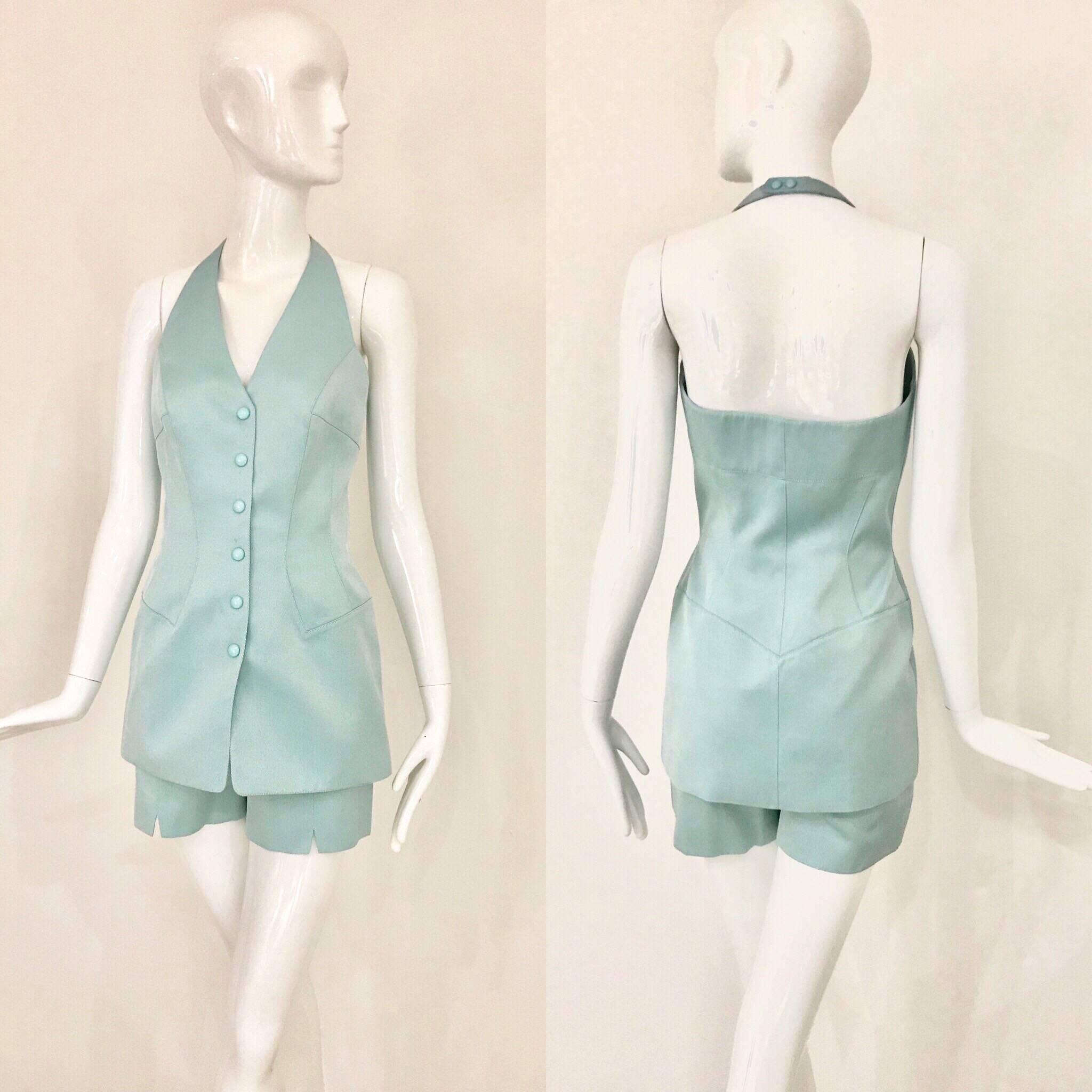 This 2 piece halter top & shorts set is quintessential Thierry Mugler!
It's "eye-catching” light turquoise blue really draws attention to this crisp fashion statement.  The halter design has an exposed back, nipped in the waist, and the