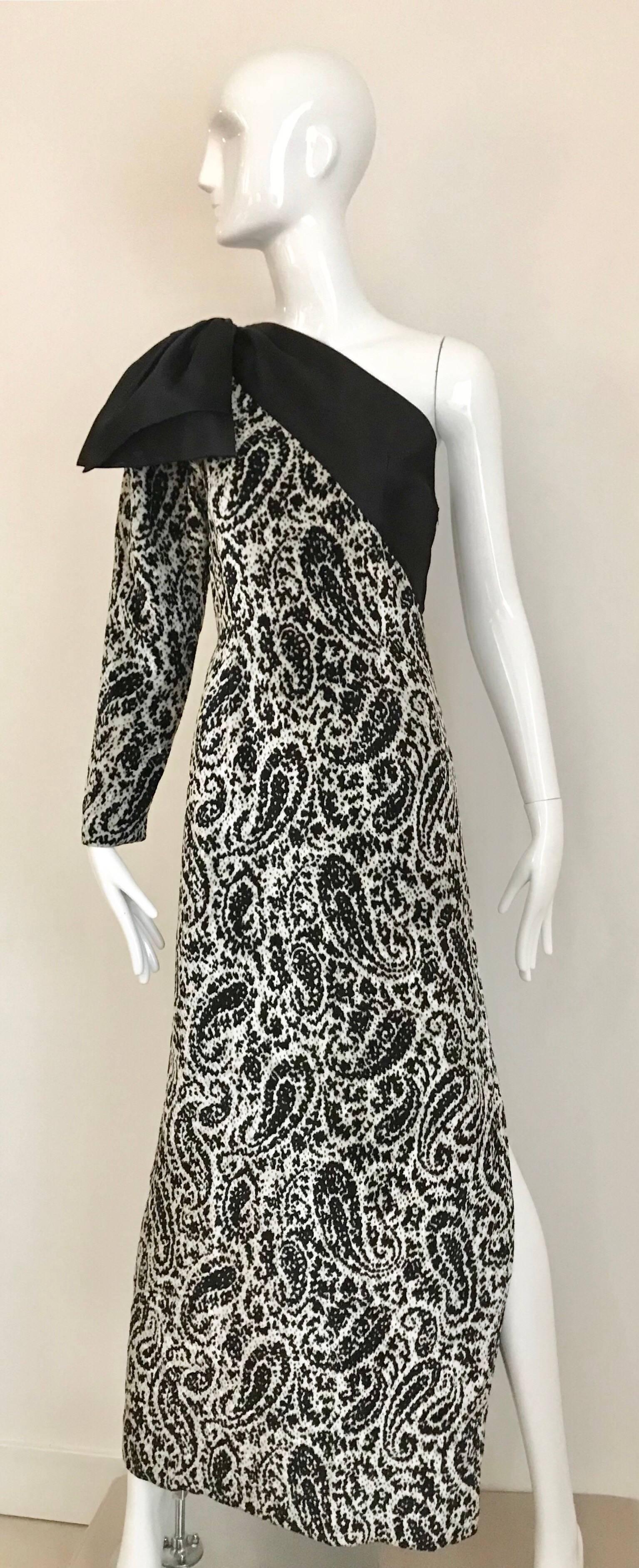 This Lanvin evening gown is both a classy, elegant fashion statement, as well as being fun!, The 90's black & white velvet paisley print, with one shoulder bow really makes a statement. Classic beauty, while keeping you toasty on a cool fall