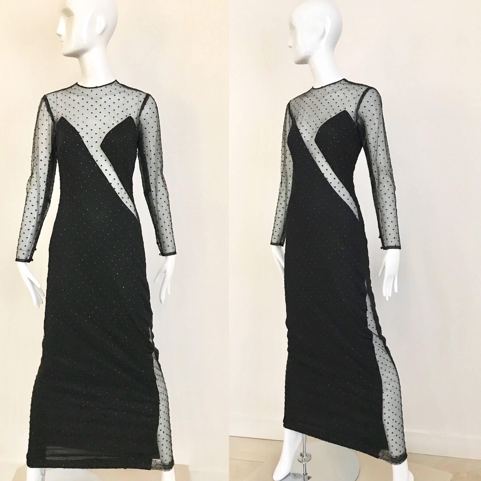 This Sexy 80's Loris Azzaro black mesh cut-out evening gown is quite daring. The cut-out starts from your left ankle and travels up to your left hip, then starts again, and travels up the bodice towards your right shoulder . There is also one long