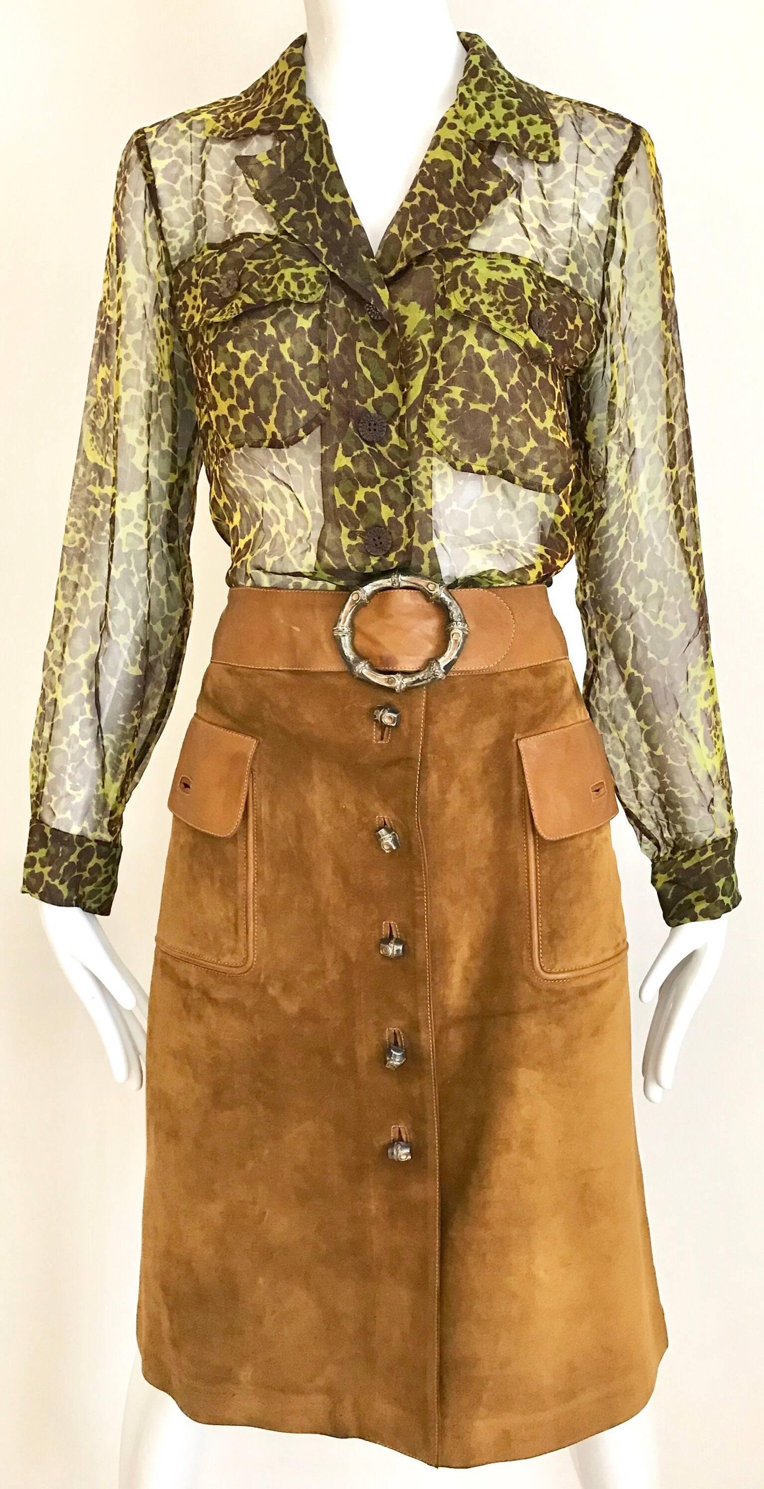 Vintage Yves Saint Laurent chartruse green and brown leopard print silk blouse.
Blouse is styled here with our vintage 1970s Gucci Brown Suede Skirt ( available for purchase at our 1stdibs store.)
Size: Small - medium ( 4 to 6) 
Measurement: Bust: