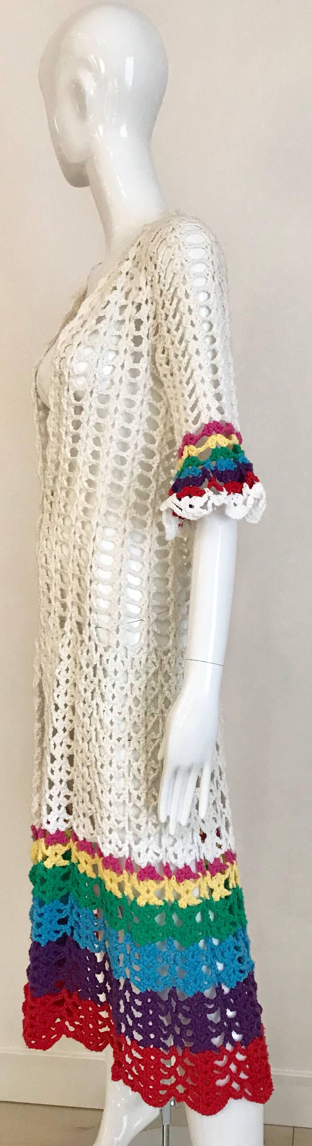 Vintage white, red, blue and green cotton crochet summer coat. Perfect for swimsuit cover up.
Size: small - medium 
