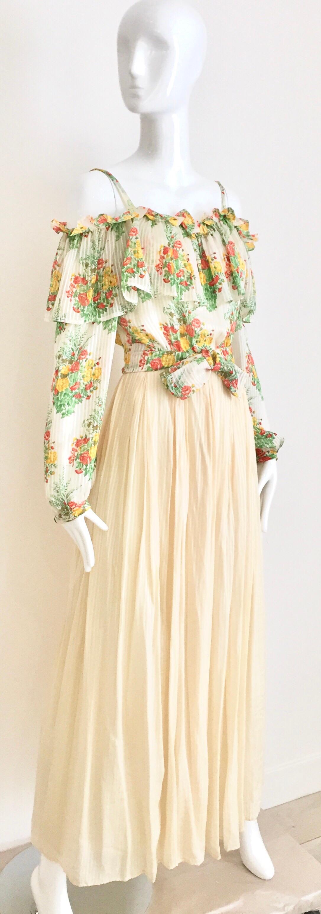 1970s  creme Andre Laug silk chiffon off shoulder maxi dress. Perfect for summer party or wedding. 
Size: Small 
Bust: 32 inches/ Waist: 25 inches / Hip: free/ Dress length: 54.5 inches
***This garment has been professionally Dry Cleaned and Ready