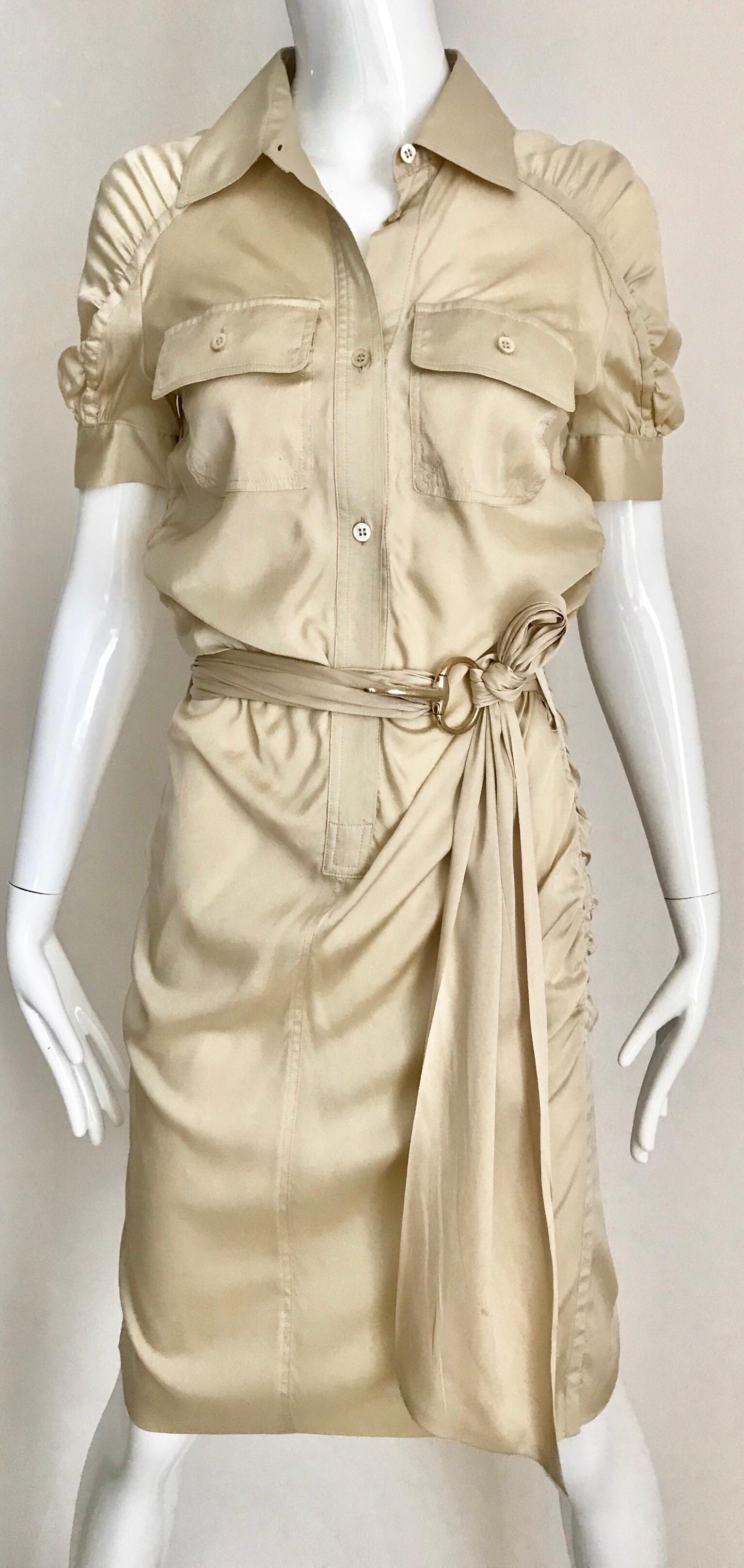 Gucci by Tom Ford tan silk shirt dress with belt.
Size: Small
Marked size 40 but it fit smaller. ( small smudge near pocket) see image attached
Bust: 32 inches/ Hip: 34 inches.
**** This Garment has been professionally Dry Cleaned and Ready to