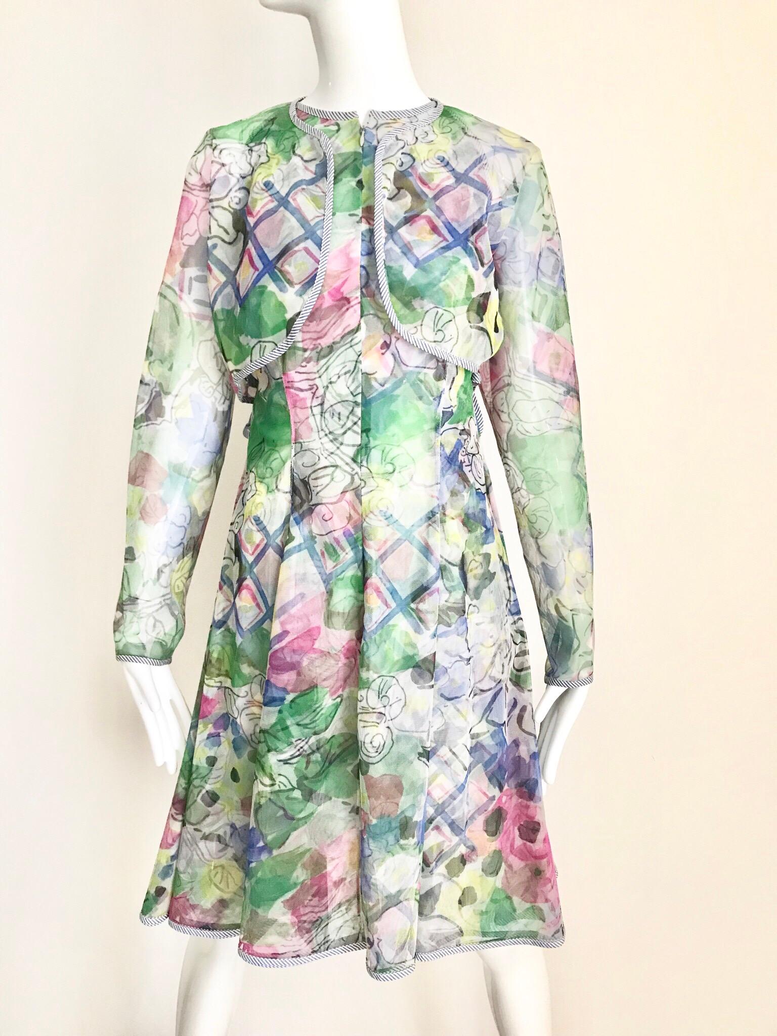 Late 1980s Geoffey Beene beautiful cocktail dress in green, blue and light pink. Dress come with crop jacket.  Dress has front zipper.
Dress size: Small- Medium ( see measurement below)
Bust: 34 inches/ Waist: 28 inches / Dress length; 38.5