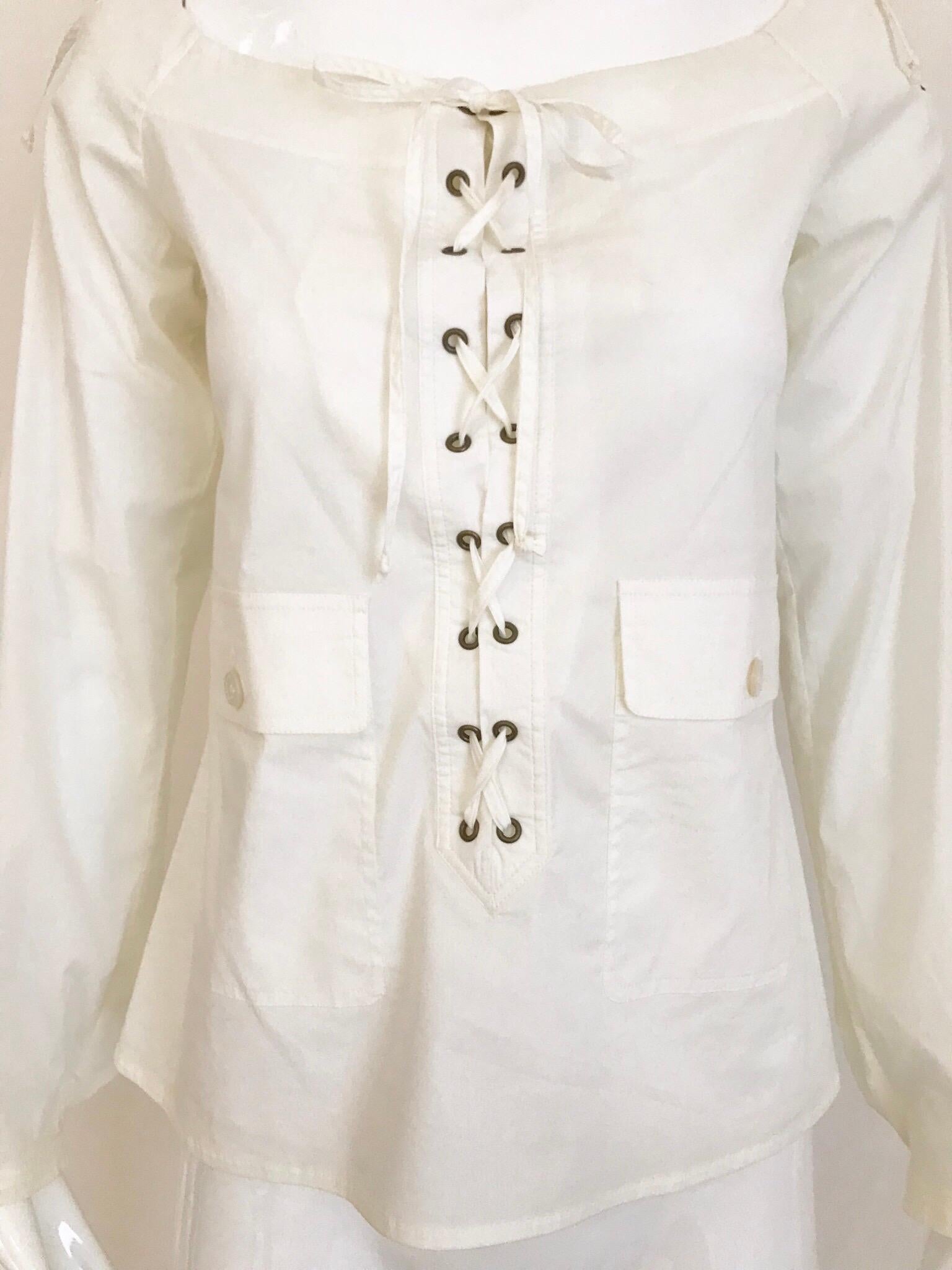 2000s YSL white cotton off shoulder lace up blouse designed by  Tom Ford.
Size: 38F/ Small - Medium
Bust: 36 inches / Blouse length: 22 inches
Blouse has some stretch and adjustable.
Garment has been professionally Dry Cleaned and Ready to wear.
