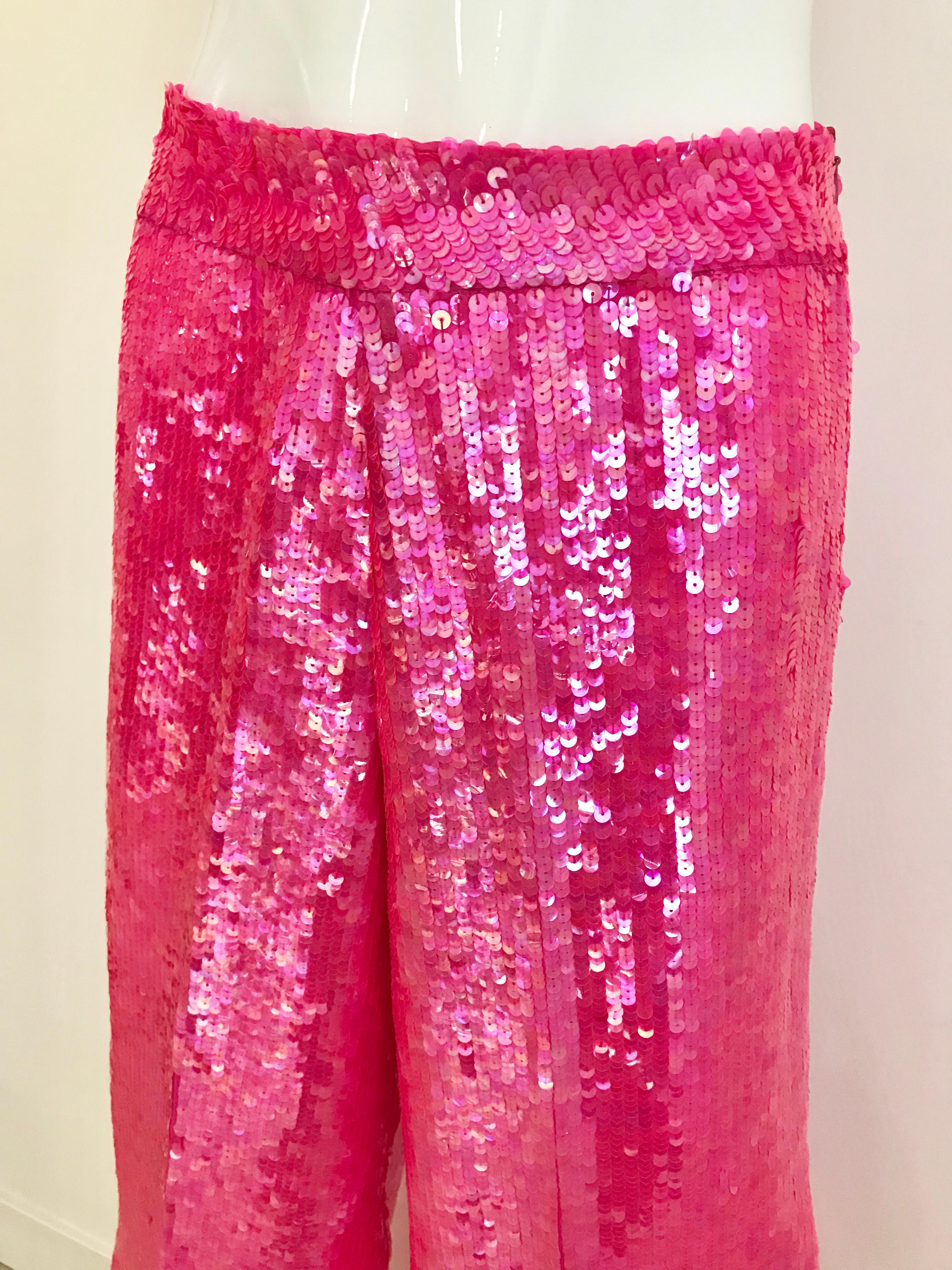 Deadstock 1980s Anna Molinari hot pink sequin shimmer pants.
Waist: 28 inches/ Hip: 38 inches/ Lenght: 44 inches
Pants is deadstock ( never worn)