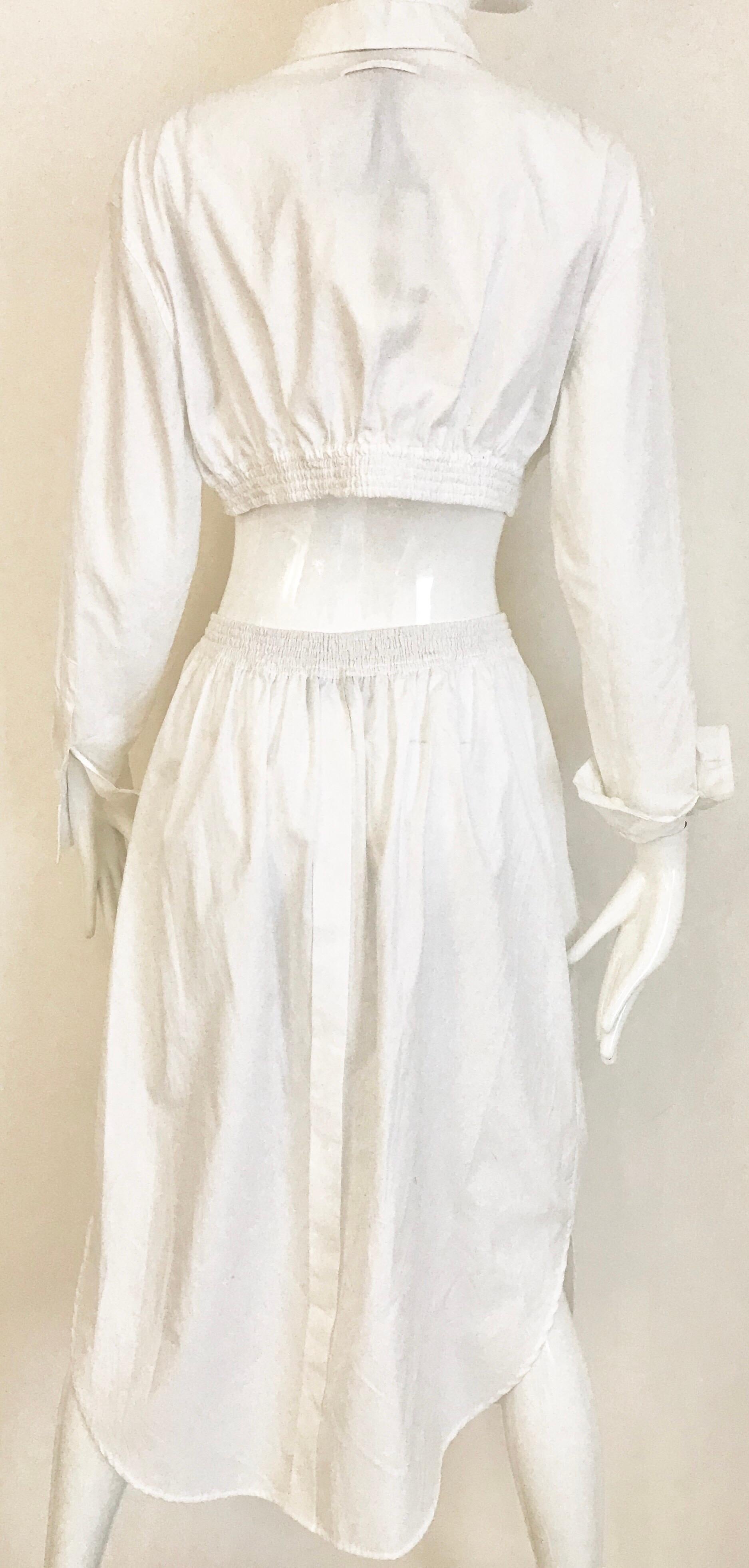This Jean Paul Gaultier white crop top and skirt combo is from the 2000’s era.  It’s 100% cotton and has a great feel.  Very casual, but sexy and bit edgy, as Gautier tends to be.  The top has an elastic enclosure at the bottom and the skirt has