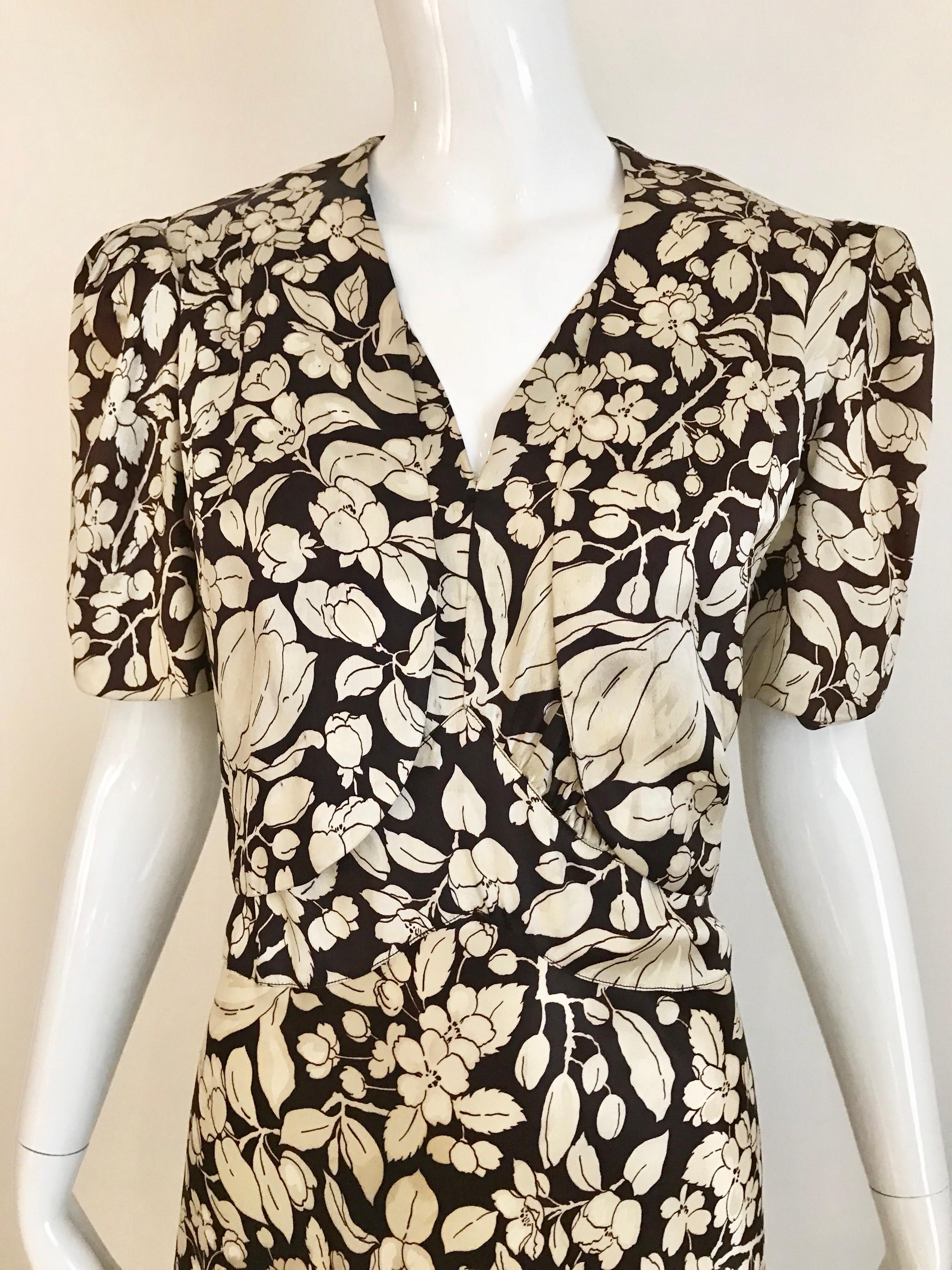 Charming 1930s Brown and white Floral print silk charmeuse gown with cropped jacket.
Perfect for wedding party.
Cropped Jacket measurement: Bust: 40 inches/ Waist: 36 inches
Gown: Bust: 40 inches/ Waist: 32 inches/ Dress length: 60 inches