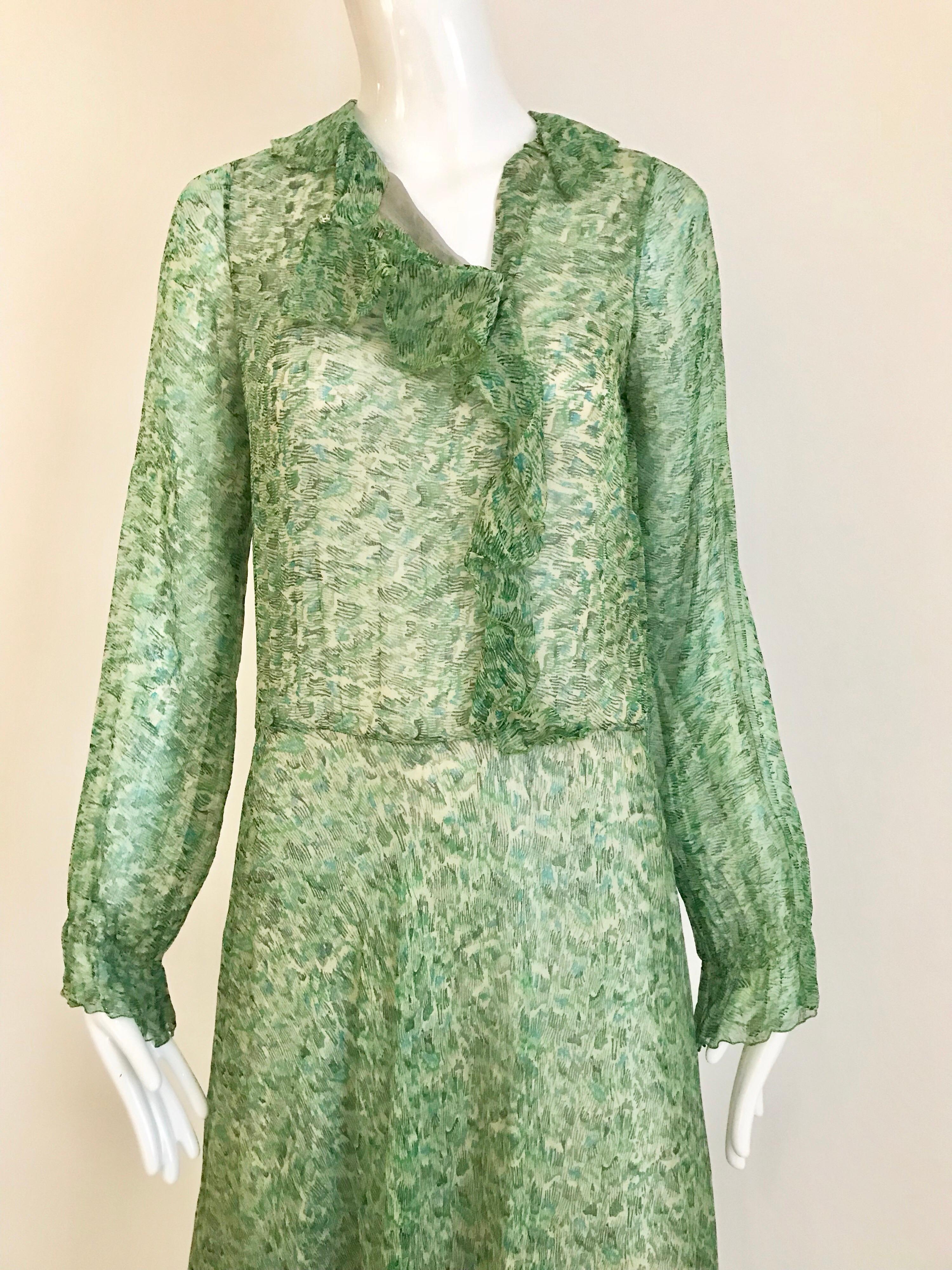 This Anna Weatherly green silk printed dress from the 1970’s has a gentle watercolor like hue and has a very traditional feeling.  Perfect for a daytime cocktail event.  Lovely.

Size: small - medium
Bust: 36 inches