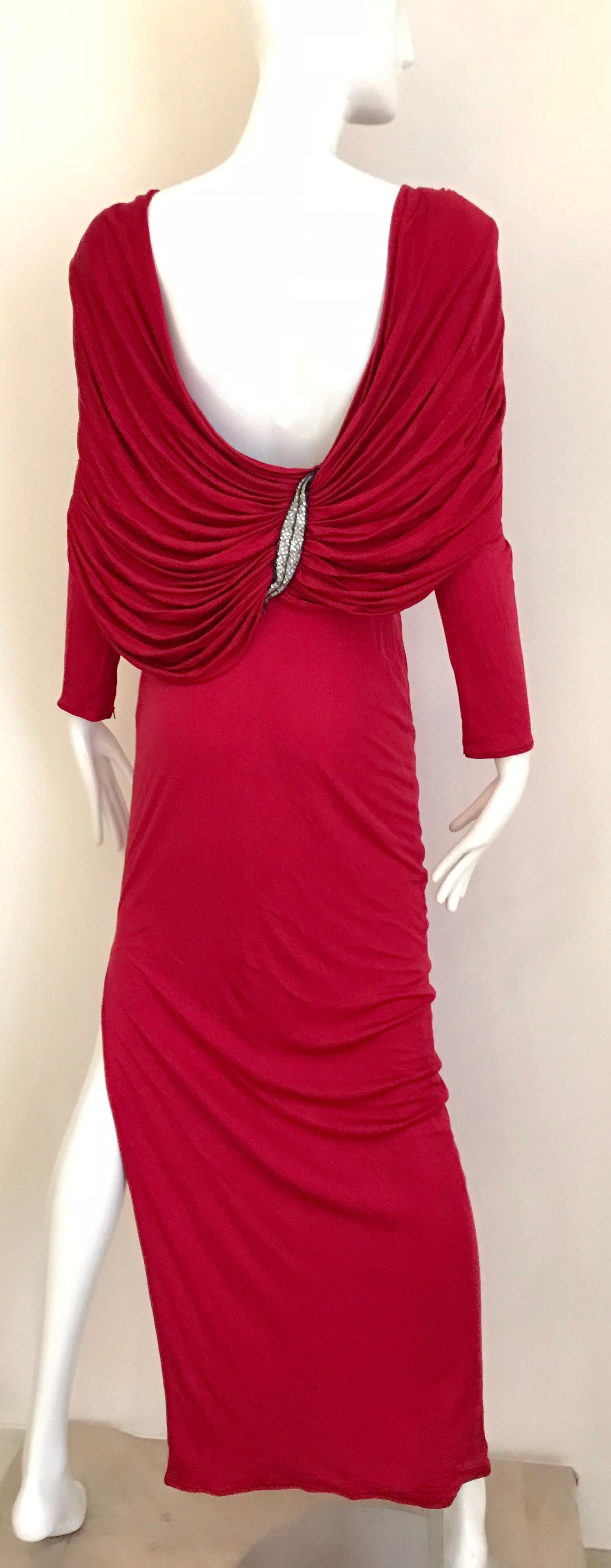 Beautiful vintage VALENTINO boutique silk jersey red ( more berry tone) long sleeve dress with open back ( drape). Dress has beaded appliqué on both shoulder. Perfect for holiday party.
Fit best for US size 0/2/ max 4.  Although the dress marked