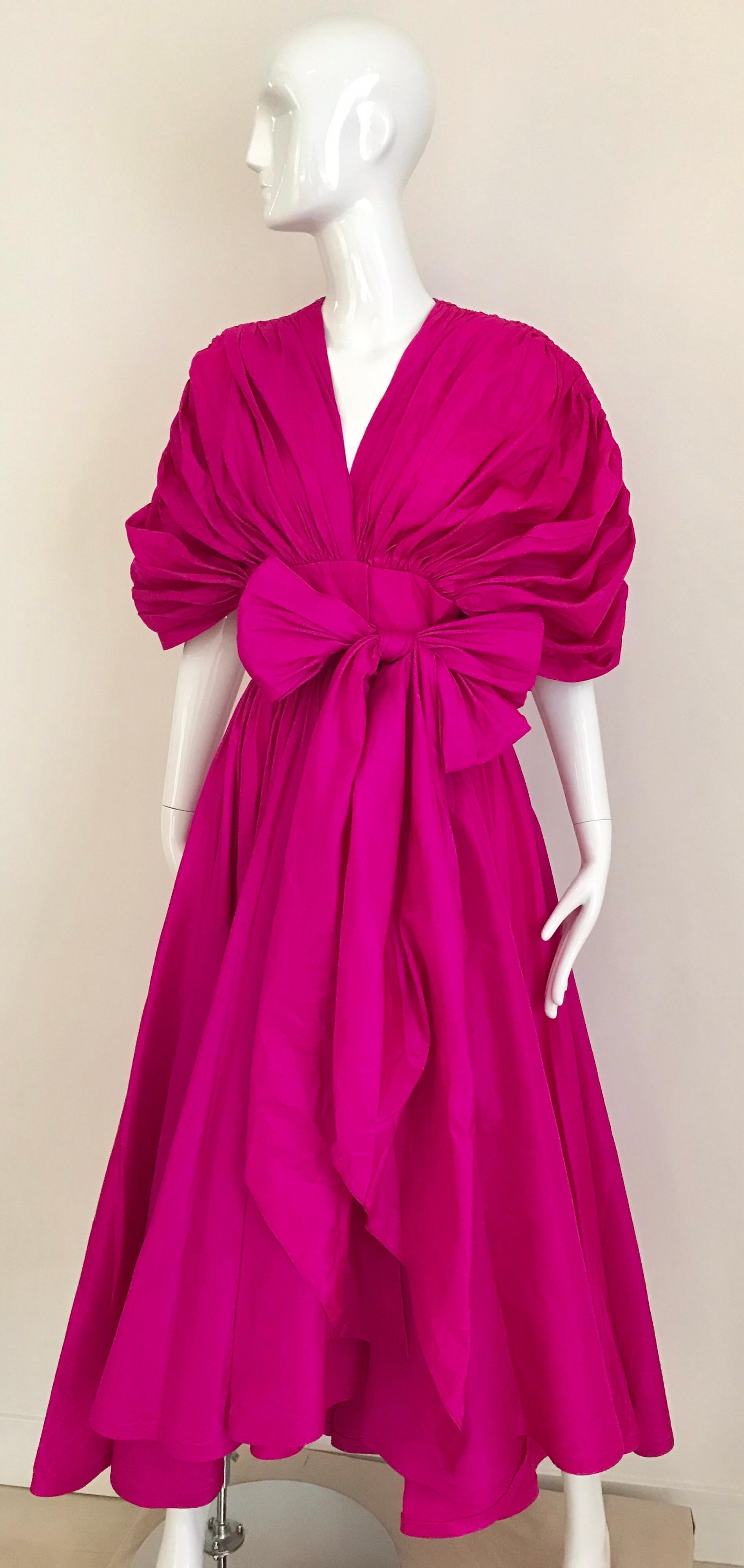 80s Oscar De La Renta Magenta wrap Silk Dress with dramatic sleeves and large sash.
Fit size : small
Bust: 36”/ Waist: 27”/ Dress length: 53” longest part/ shortest hem 46”
