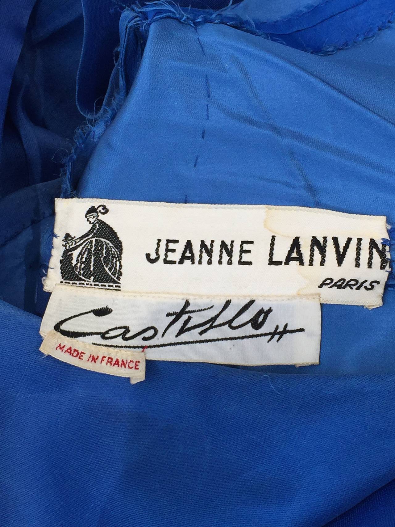 1950's royal blue silk organza gown from Lanvin, Haute Couture. This
bears the famous Lanvin / Castillo label. With its full skirt and unusual
one shouldered look, this dress is totally modern.  Great addition to Museum or collector!
Condition : see