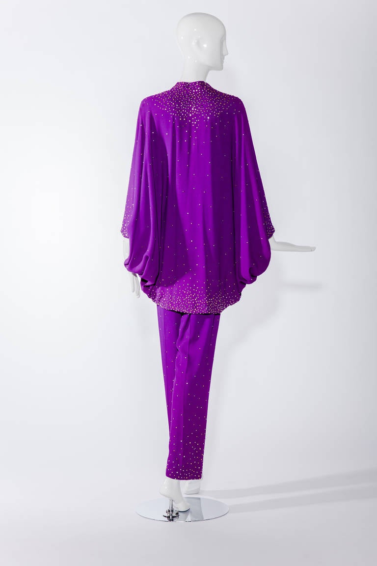 Stunning deep royal purple, studded silk crepe, evening ensemble created by Halston in the 1970’s. 
Blouse fit size 10 
Condition : there is a slightly faint discoloration on the shoulder (hardly noticeable when worn because of the fold) and faint