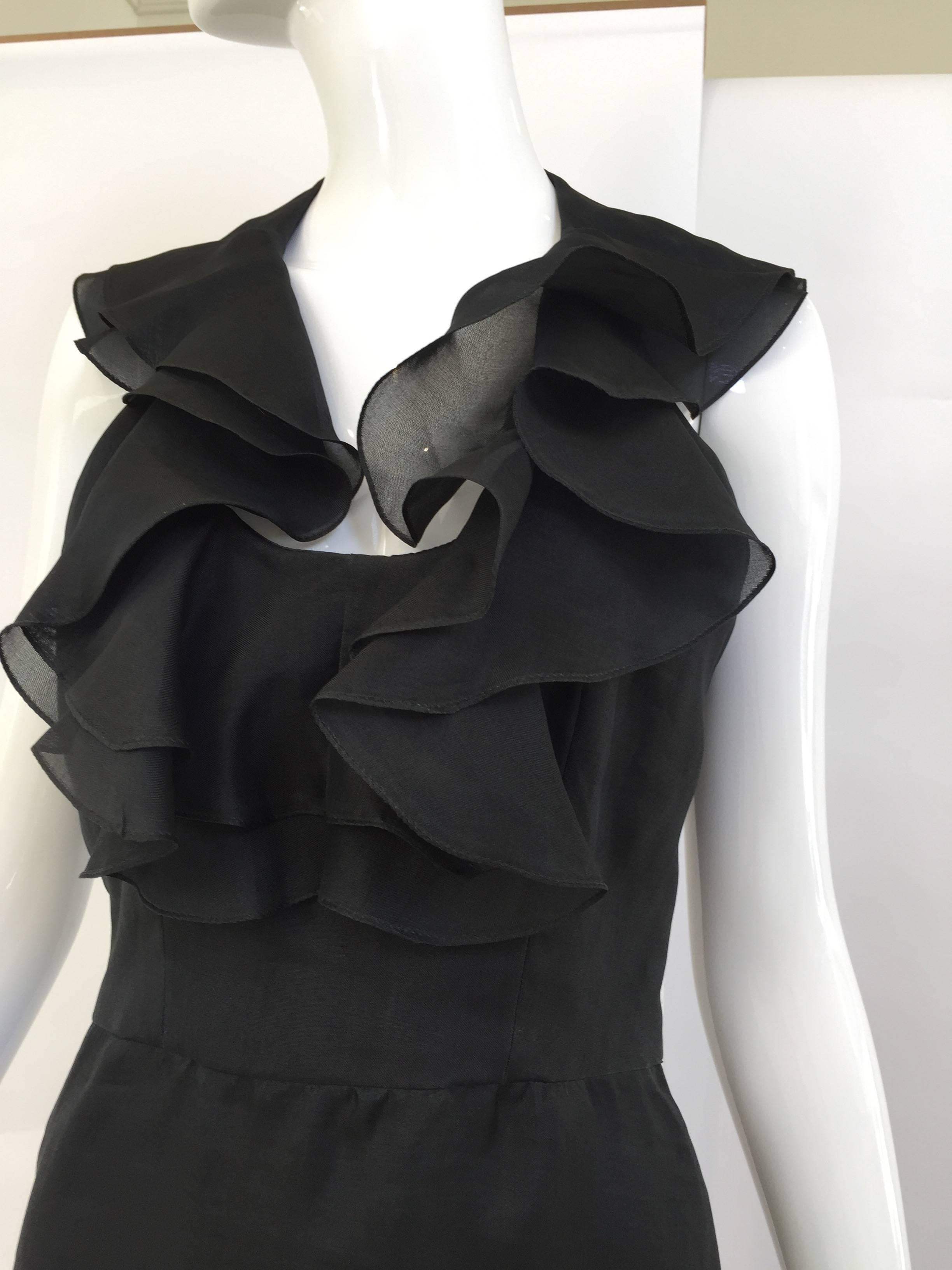 1970s Pierre Cardin black silk organza halter dress.
Bust: 34