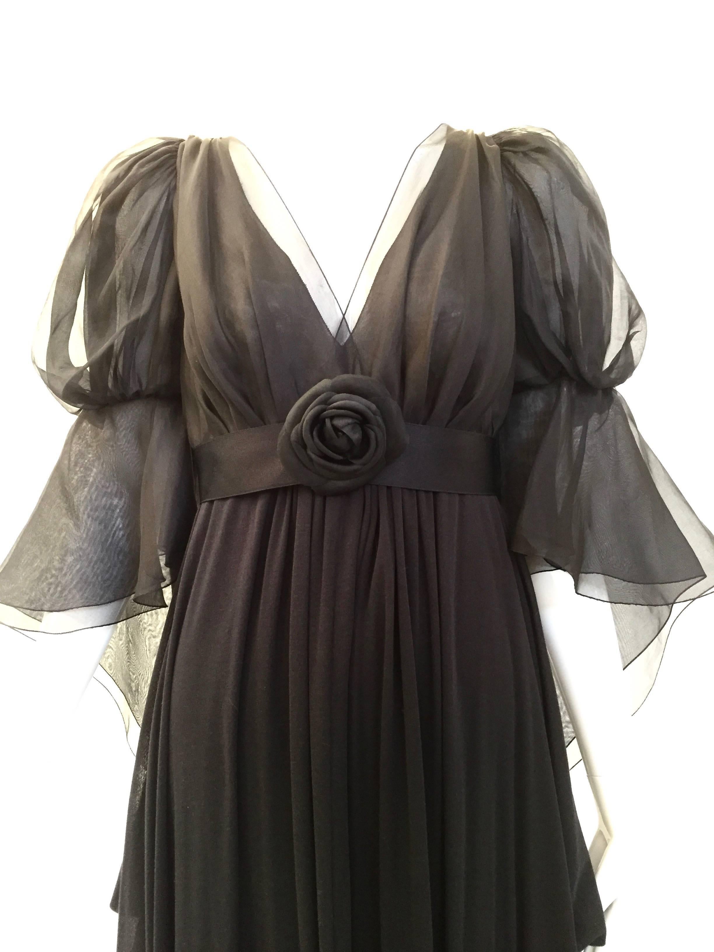 Chanel gown. empire waist.Fabric : silk chiffon and jersey
size : 40
Excellent condition with tag attached. Original price tag was $7335