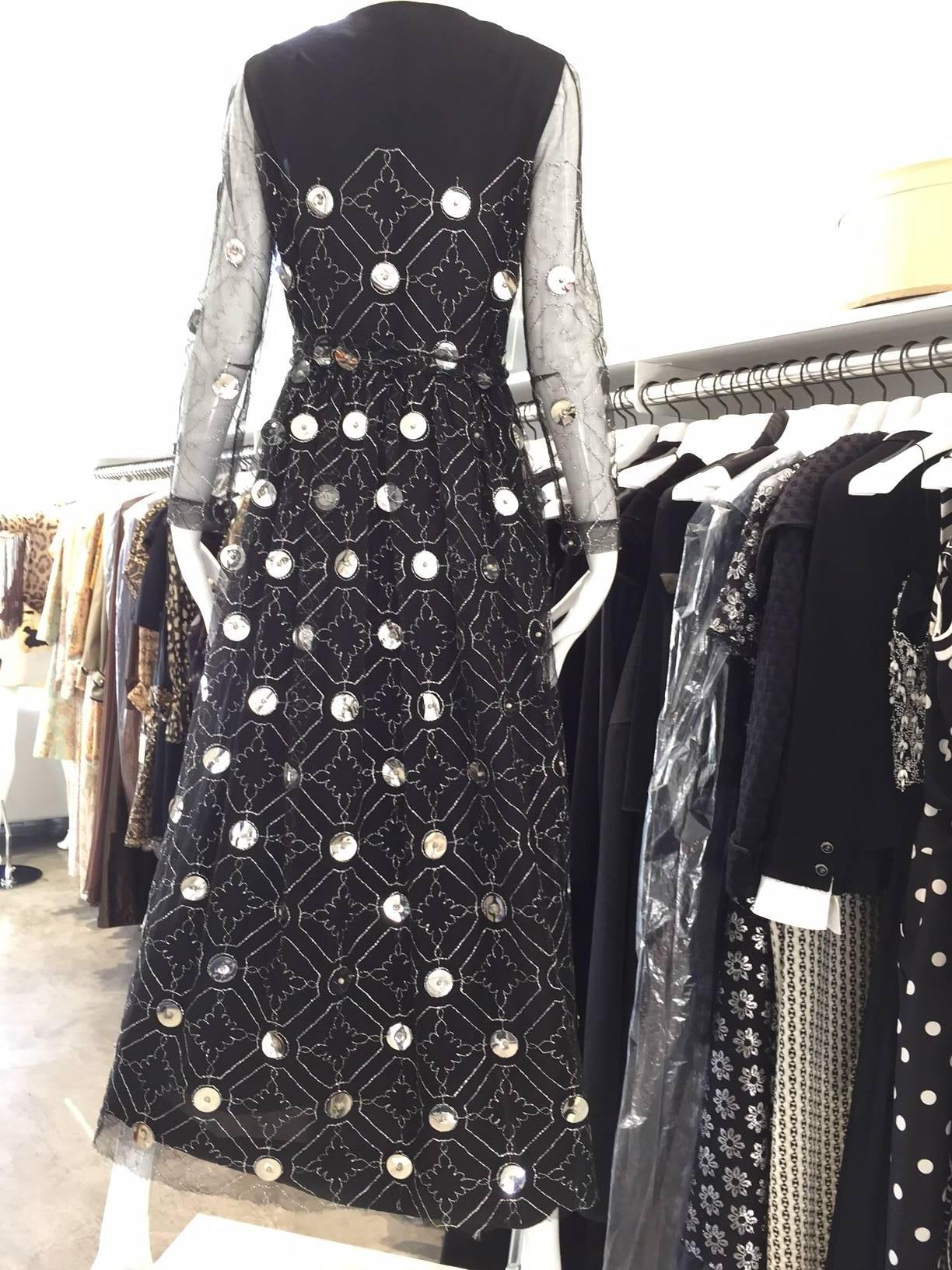 Beautiful Oscar De La Renta long sleeve black dress with large silver pailletes. 
Size : 4/ Bust: 32