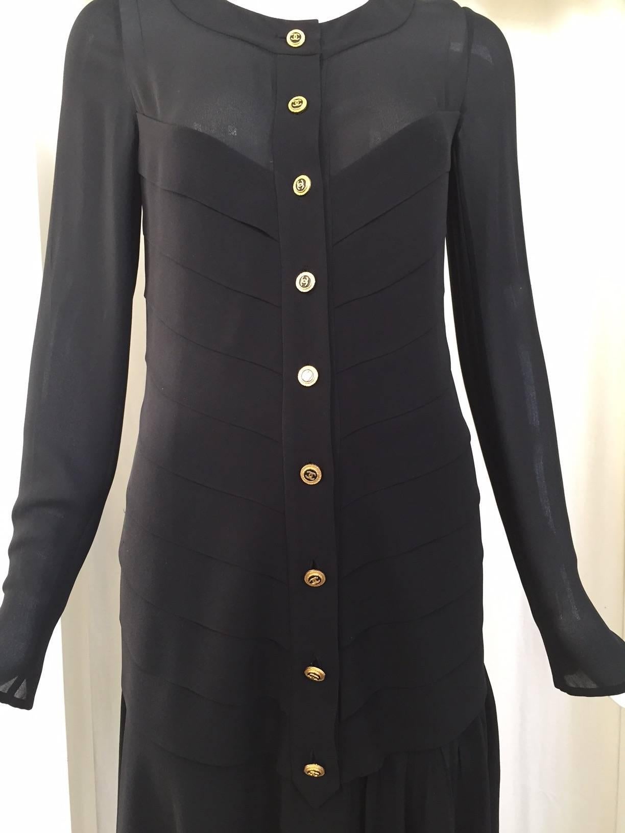 Classic vintage Chanel Black  silk crepe dress with asymetrical hem. 
Bust : 34