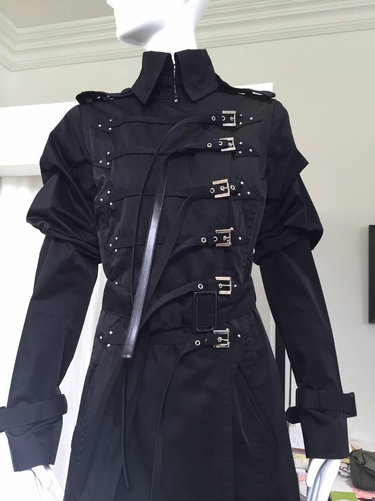 Vintage 1990s Gianfranco Ferre black bondage style nylon Trench coat.
marked size: 40/ Medium - Large
Measurement:
Shoulder: 16"/ Bust: 19"/ Waist: 34"/ Hip: 38"/ 
sleeve length: 24" with 10" circumference. Coat length: