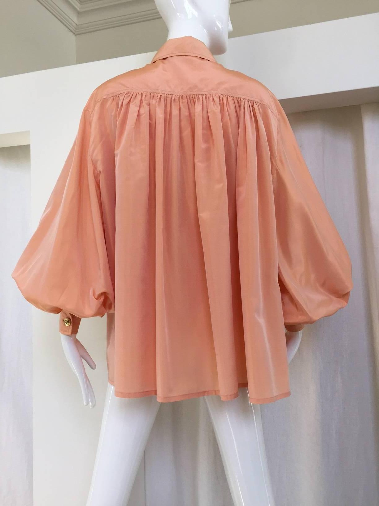 Vintage Christian Dior bishop sleeve peach silk blouse with dramatic big sleeves. Gold buttons. 
marked size: 42
Size: 8/ LARGE
