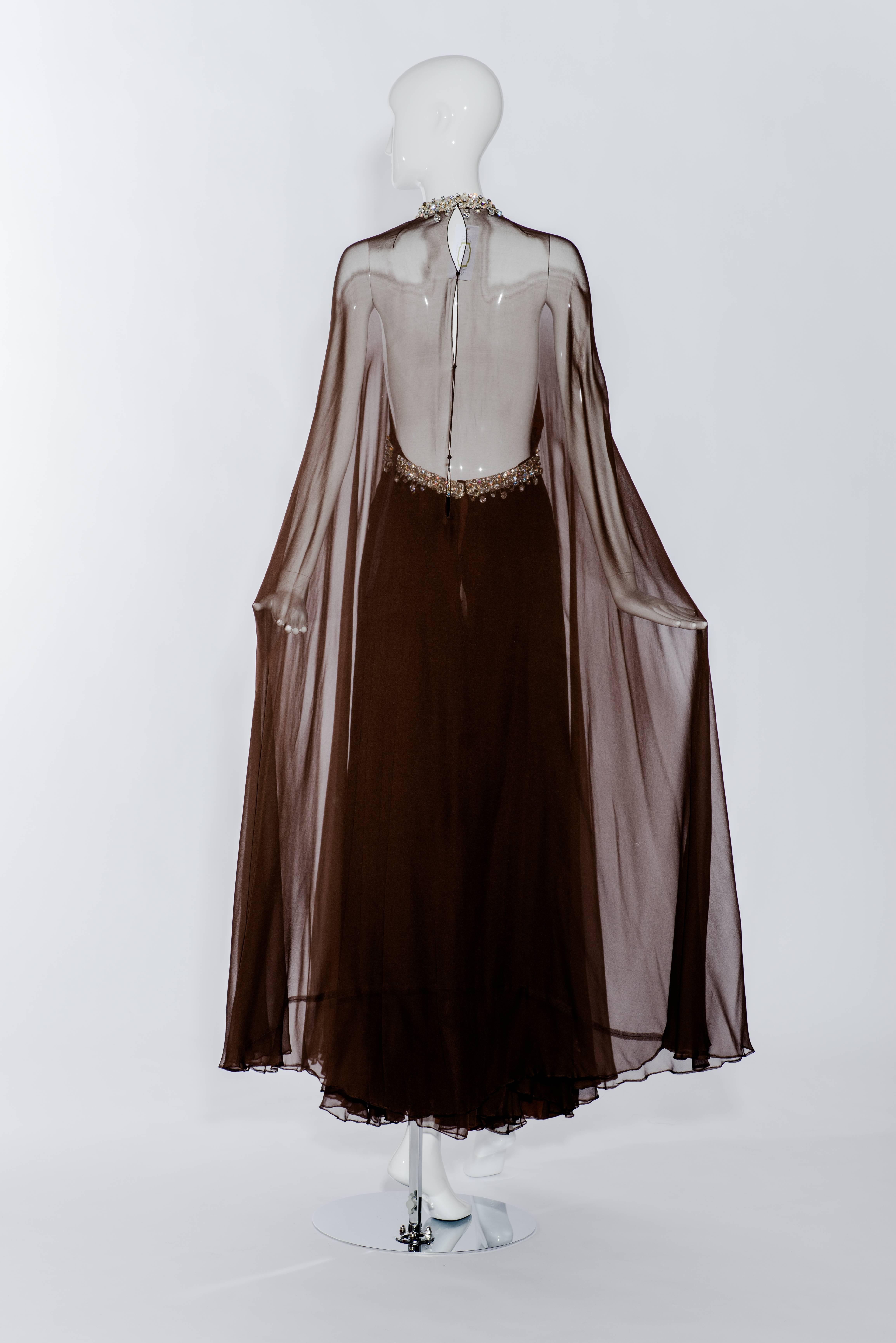 Gorgeous 1970s dark brown flowy silk chiffon gown with jeweled neckline. This gown reminds me of Stavropolous, Halston or Sarmi. Perfect for black tie party.
Size: 2 / Small
Bust: 30"
Waist: 28"  (empire waist)
Length: 55"