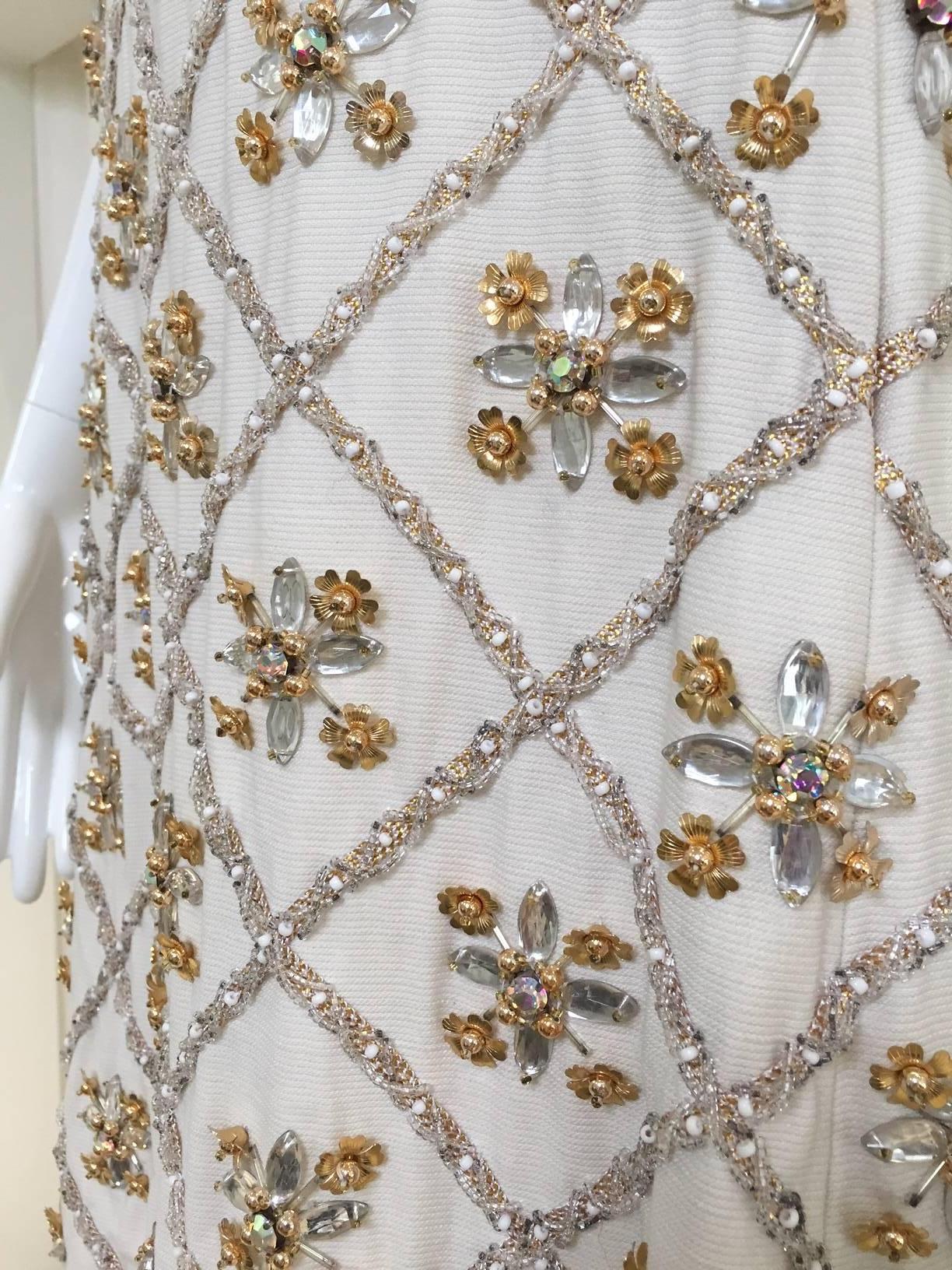 1960s Malcolm Starr off white encrusted glass rhinestones cocktail dress.
Dress has pockets.
Bust: 31