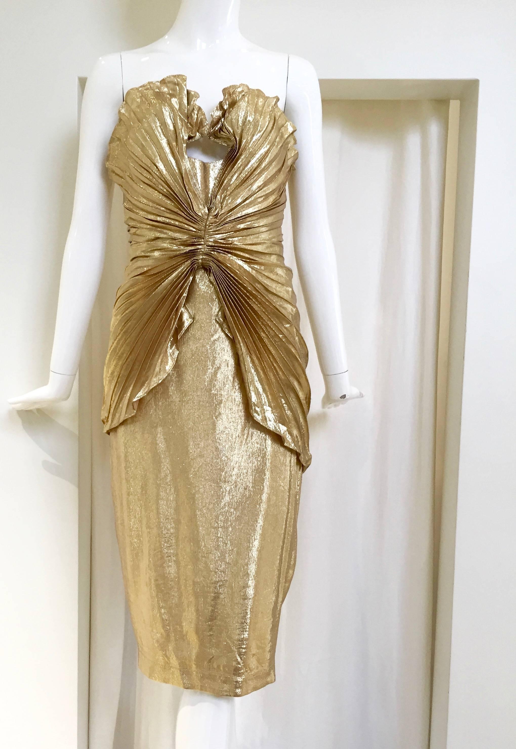 Vintage  late 80s Thierry Mugler  Iconic gold silk lame bustier dress. Size: 2
Bust: 3o"
Waist: 26"
Hip: 36"
Length: 36 1/2
