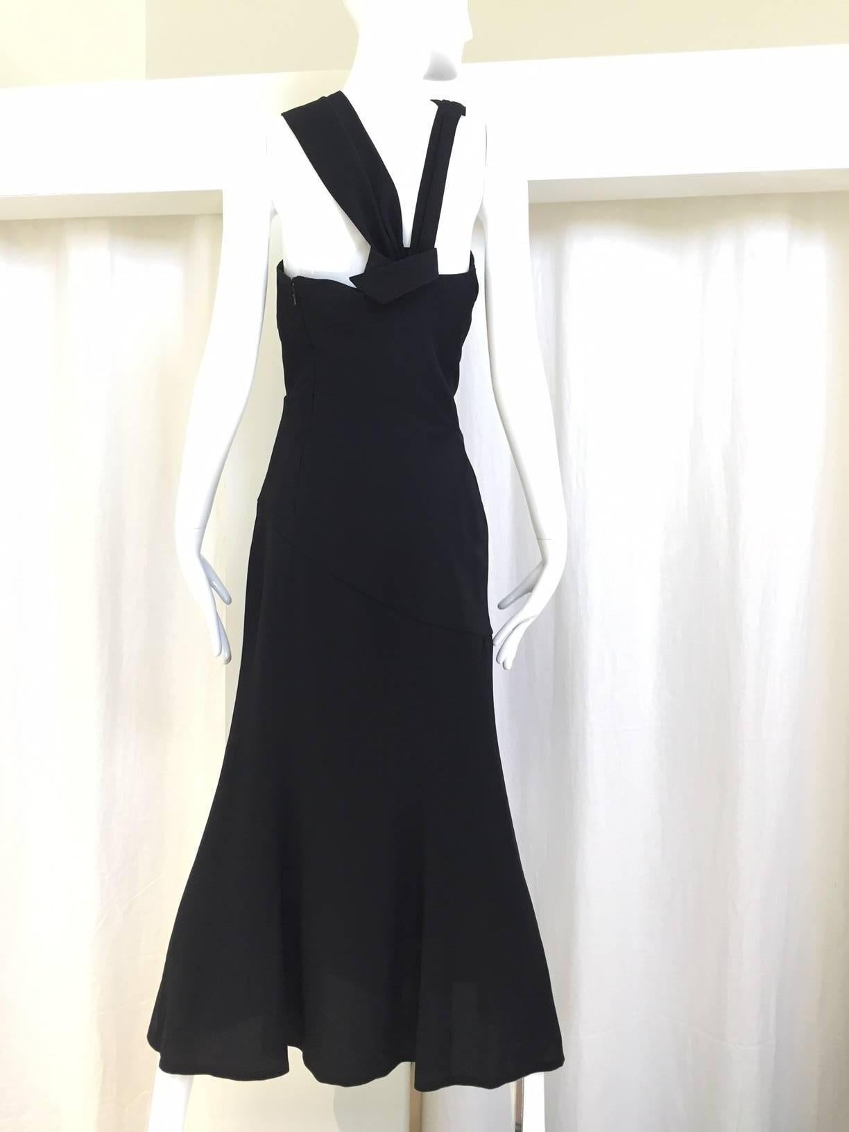 Sexy Vintage Thierry Mugler black dress with asymmetrical neckline.
Perfect cocktail dress for summer.
Slit on the side. Tag size: 38
Bust: 33