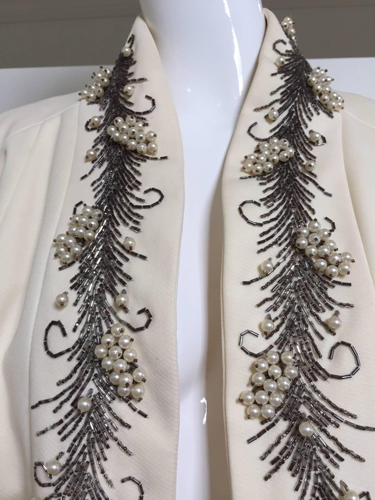 What a beautiful evening coat from Lilli Ann! Coat! It is creamy white, embellished with heavy vines of smokey silver glass beads highlights with pearls.
Bust: 53"/  Waist: 58"/  HIp: 60"/  Length: 41"  (fit size: