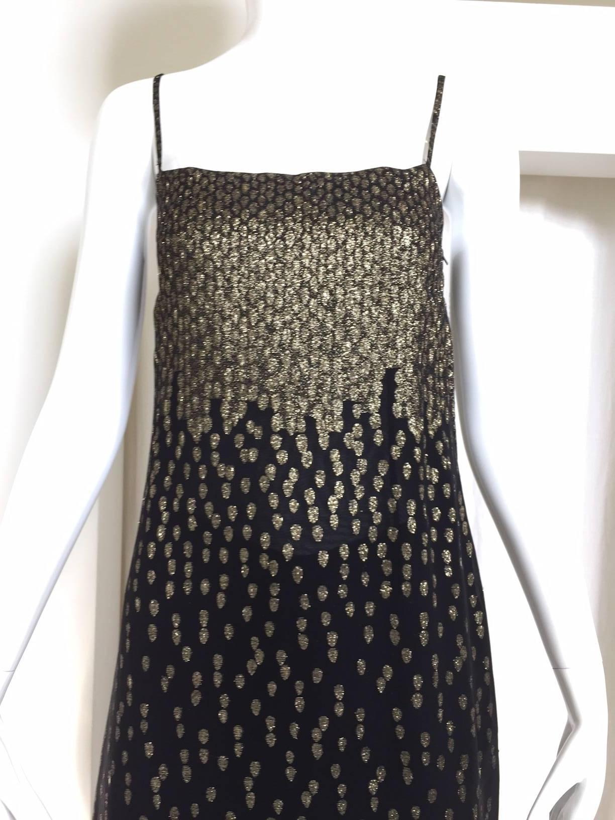 70s Christian Dior Metallic gold and black silk tunic top and pant ensemble. spaghetti strap and zipper on the side. 
Fit US size 2
Bust: 32" / Waist: 29" / Hip: 32" / Tunic top length: 45"
Pant waist: 27" (elastic) / Hip:
