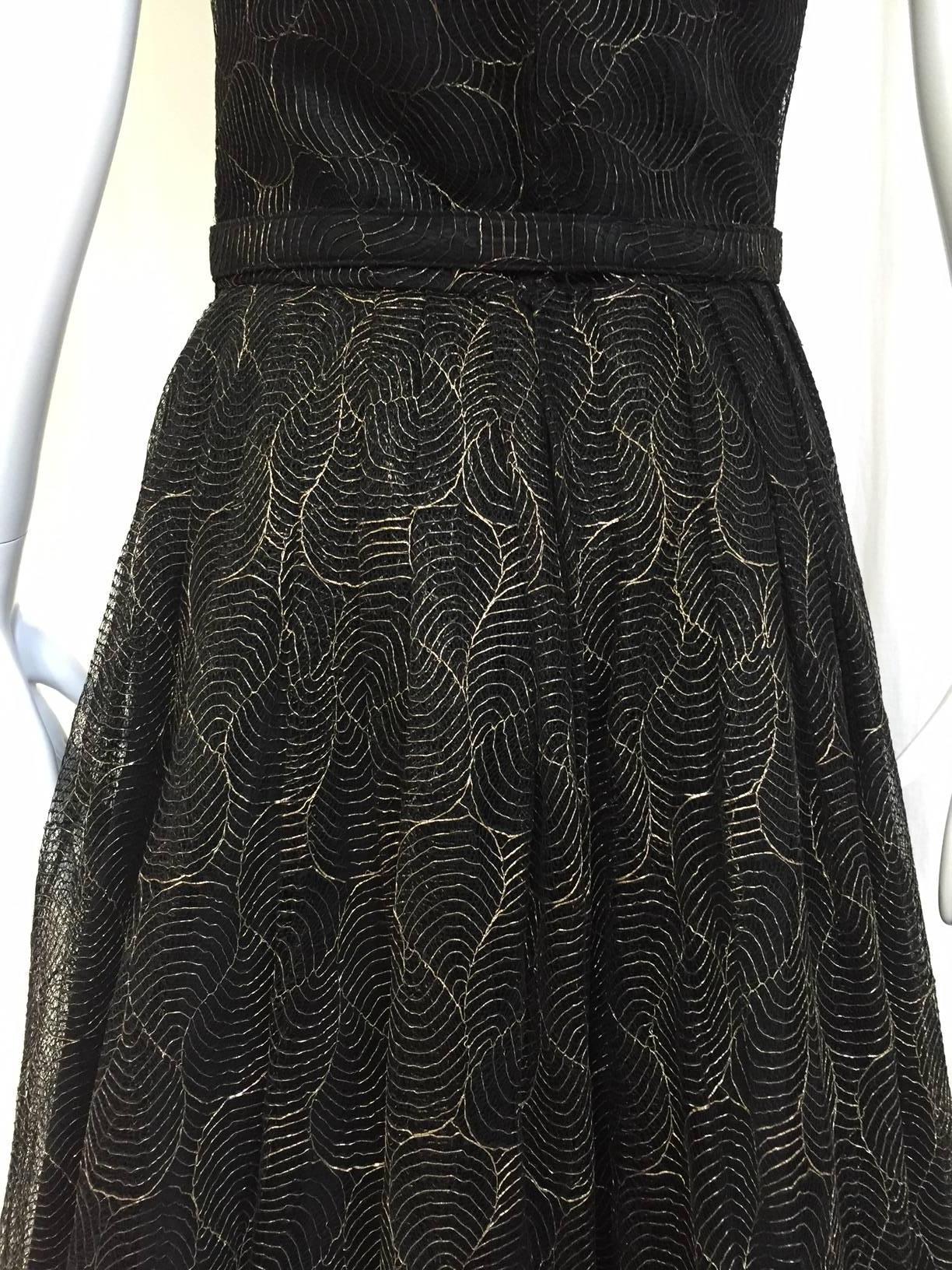 1950s Black and gold lace cocktail dress with belt. excellent condition.
Bust: 34
