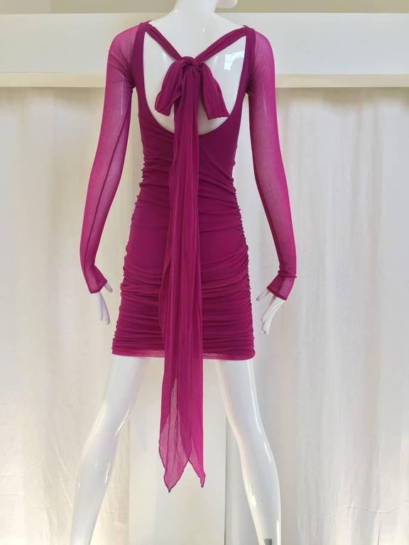 90s Giorgio Di Sant Angelo fuschia knit dress with long sash at the back.
Fit size: 2/4/6