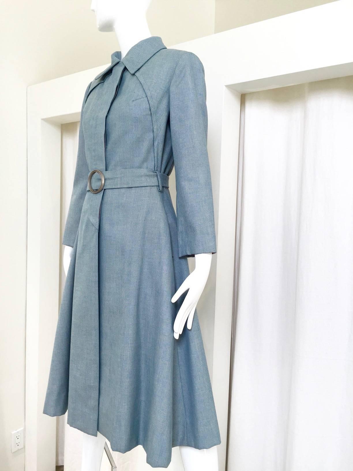 1970s Donald Brooks light blue cotton trench coat with belt. 
Bust: 36