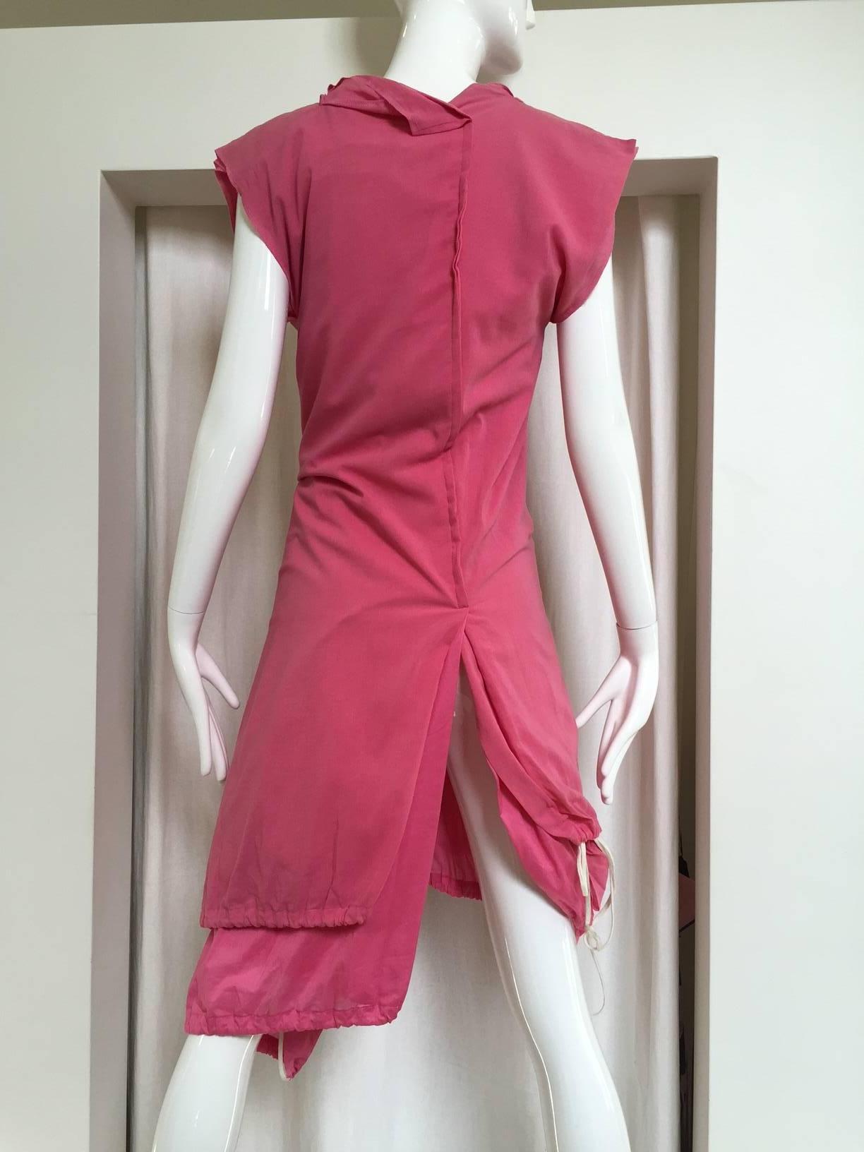 2007 Comme Des Garcons buble gum pink cotton double layer shirt dress or it can be worn as vest top with drawstring. two different double layer shirt dresses in two slightly different pink fabrics are joined down the rear center seam, each layer
