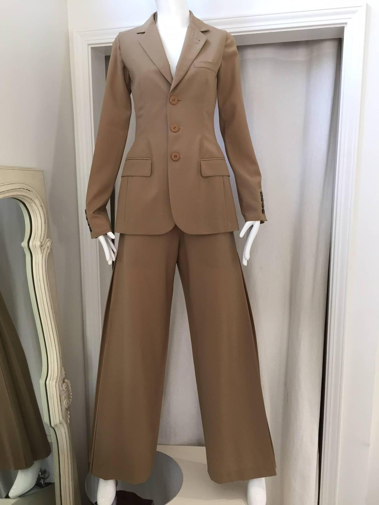90s Jean Paul Gaultier tan light wool vest, pant suite with detachable sleeve. Wide pleated pants.
Vest: size 4
Pants: size: 6