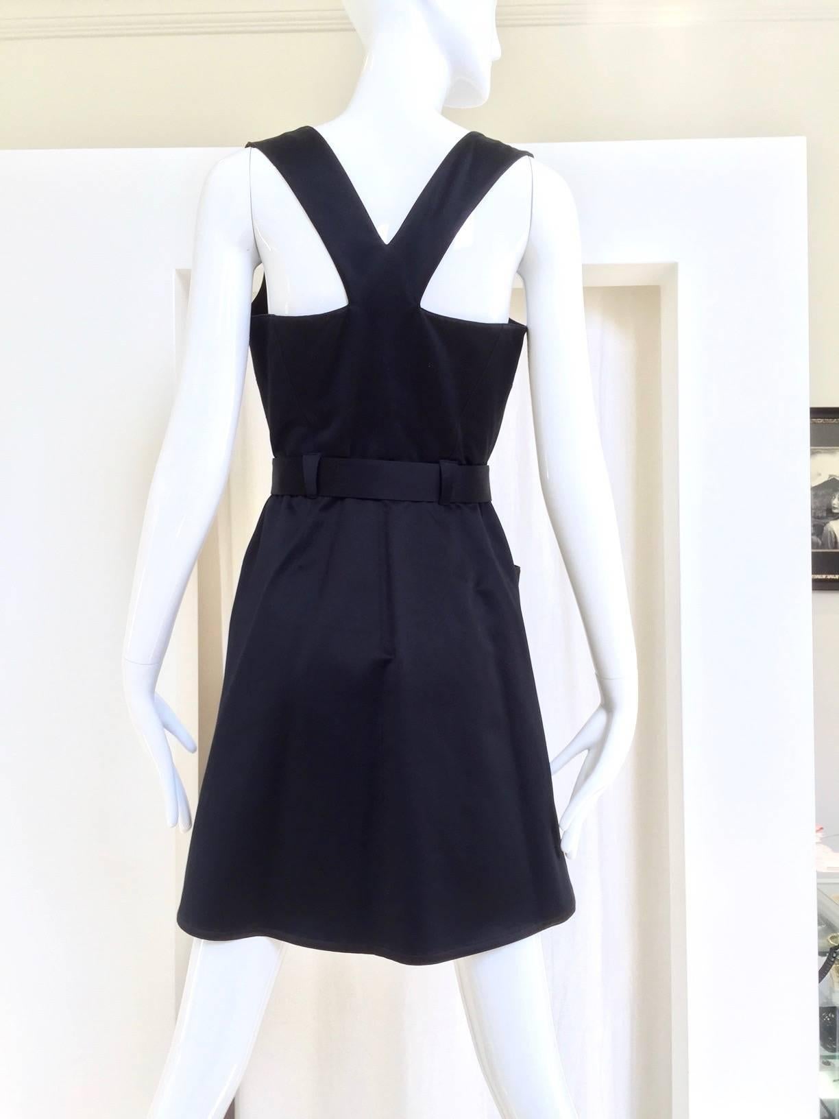 Vintage 1990s Mugler black cotton mini wrap dress with acrylic belt and criss cross back.  Chic summer cocktail dress. Size: Small

Bust:34