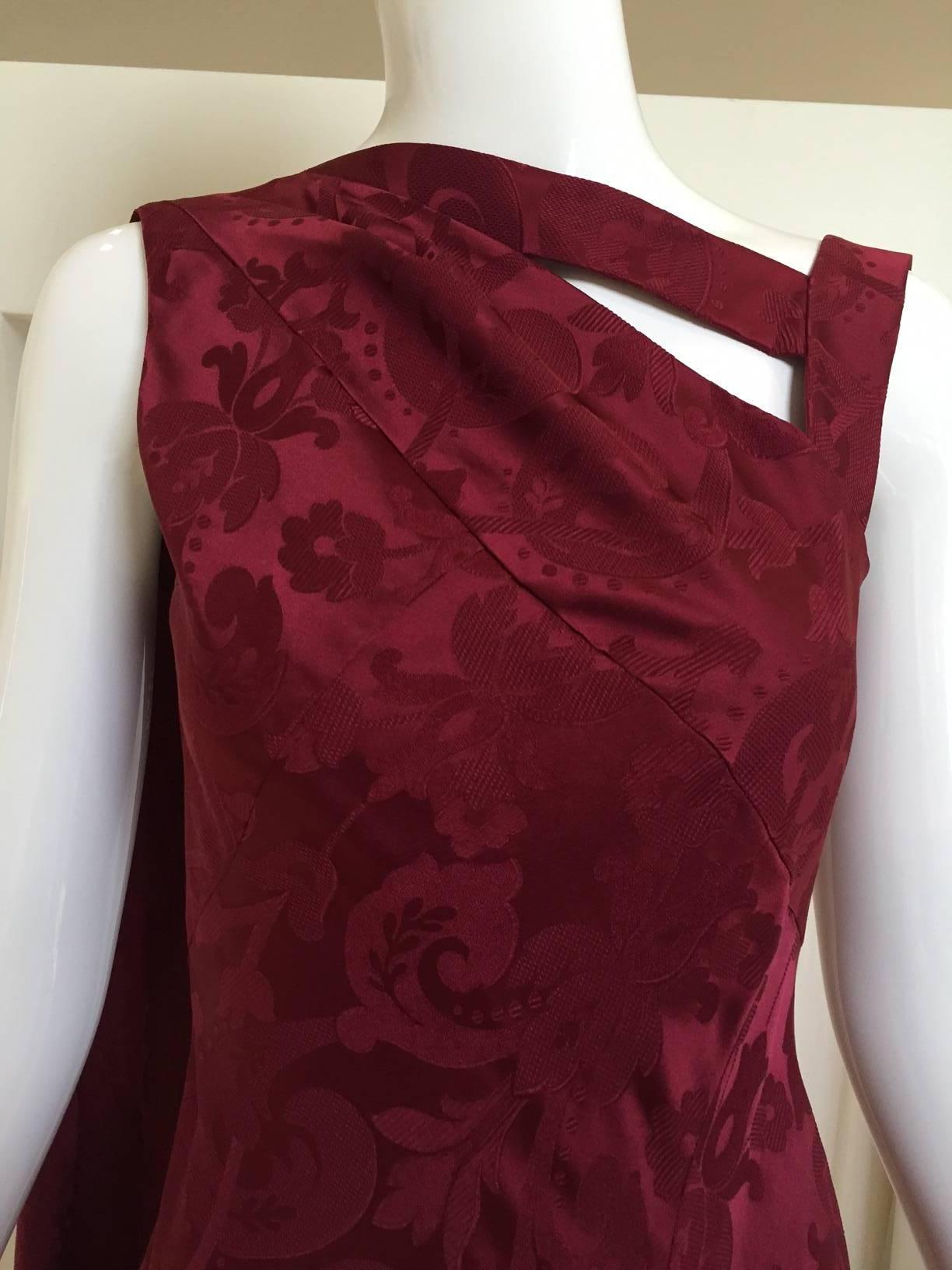 90s Vintage Christian Dior by John Galliano maroon silk jacquard gown with long sash draped at the back. slit in the front.
marked size 6 but fit smaller. Perfect for size 2/4 
SMALL