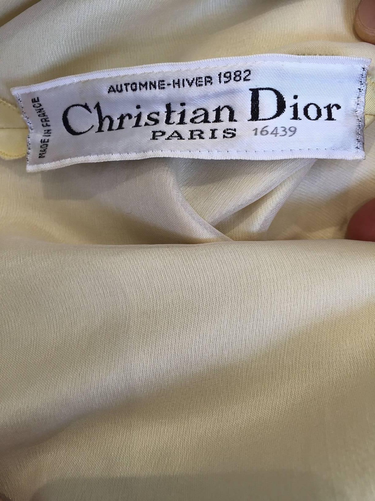 Dramatic Christian Dior by Marc Bohan haute Couture silk moiré in light yellow and black velvet bow one shoulder dress with buble hem . 
Beautiful Museum quality dress. Size: 2/4 SMALL
Bust: 32