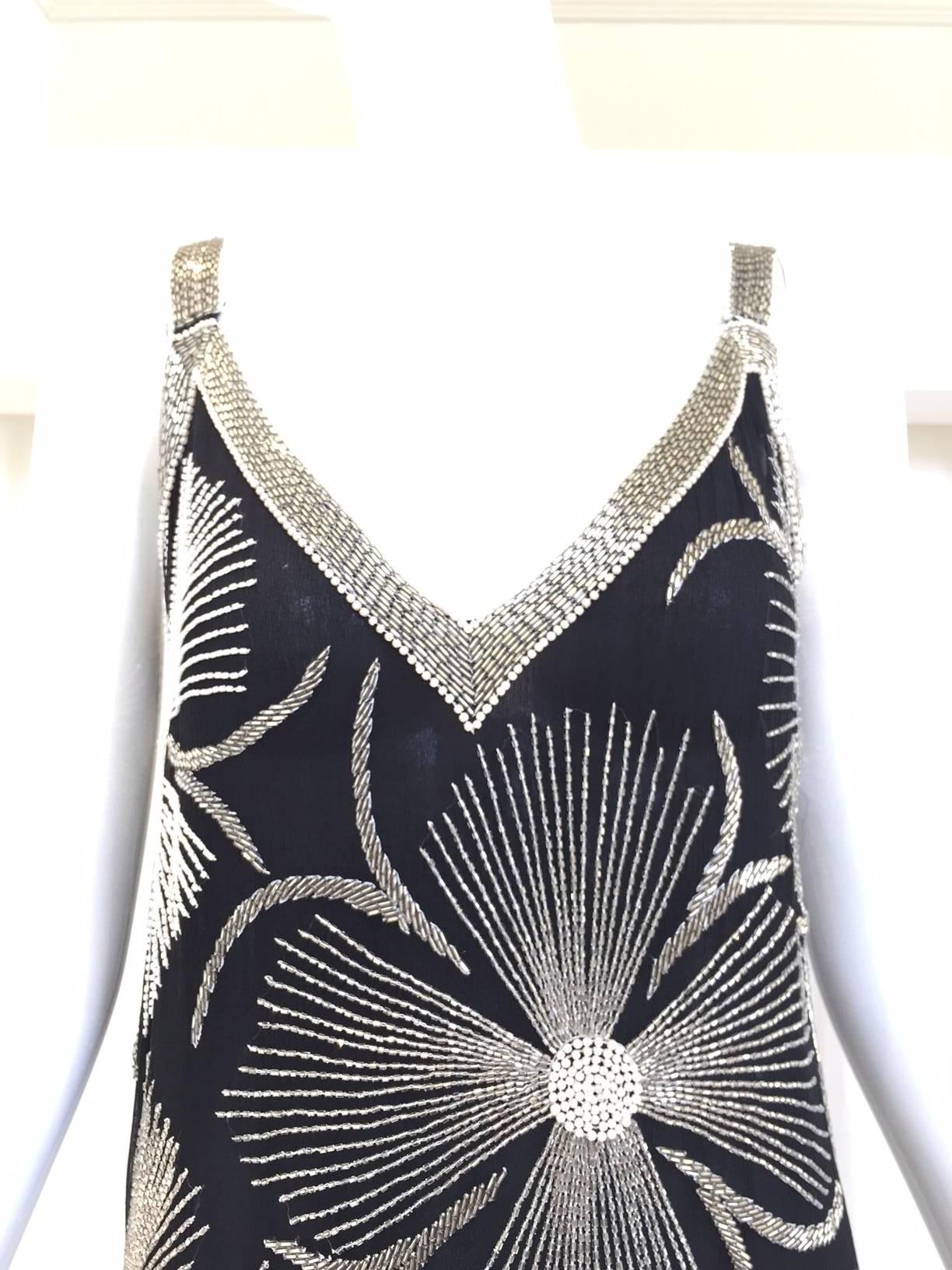 1980s Vintage Black and White Floral Silver Beads Flapper Style spaghetti strap Dress. 
Dress in excellent condition. Fit Size Small - Medium ( 2/4/6)
Bust: 36