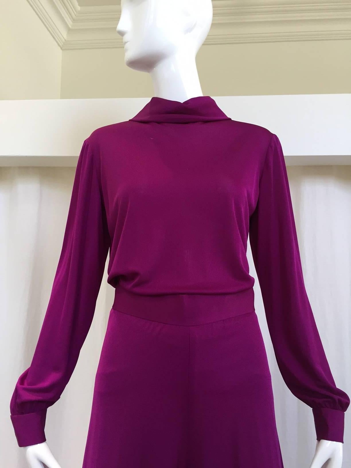 Very lovely, lightweight purple Emilio Pucci silk two piece. Blouse has a loose turtleneck, zipper closure on back and button snaps on cuffs. Harem pants have clasp and zipper closure on back and button snaps on ankle cuffs. 
Measurements -