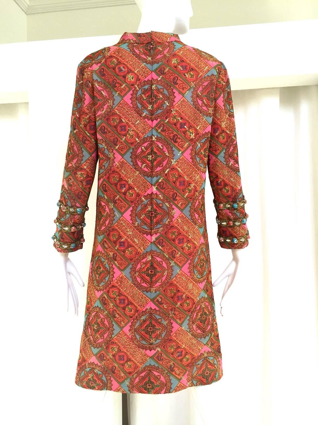 60s Bill Blass pink, orange and blue silk paisley print dress with jeweled cuffs.
Bust: 36