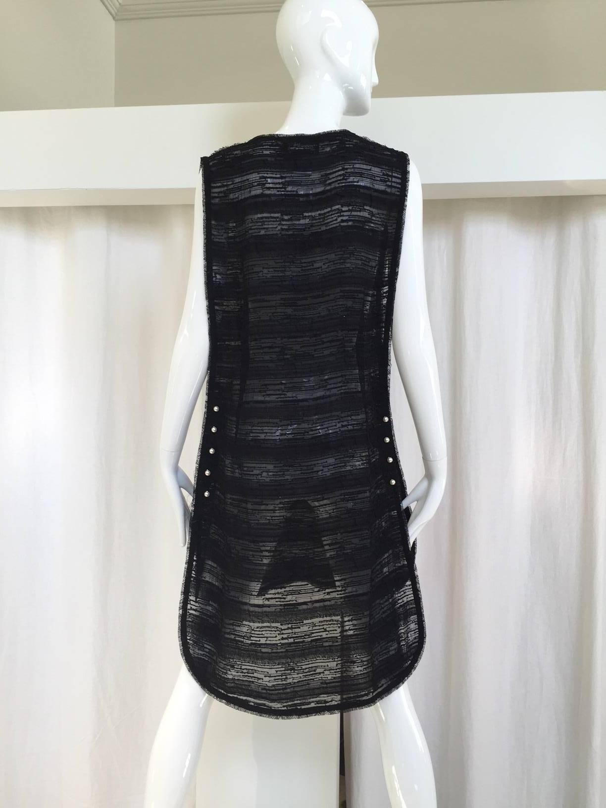 2004 CHANEL black silk tunic with pearls fastener on both side. 
marked size: 40
Bust: 34