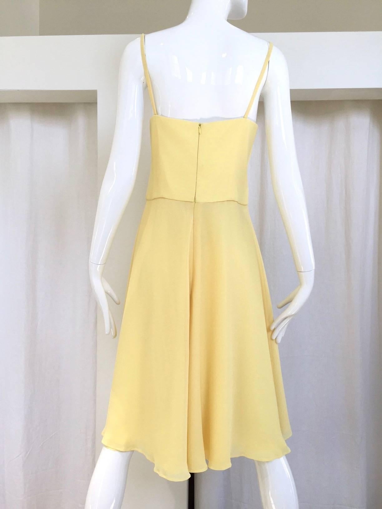 90s Escada yellow silk chiffon cocktail dress withcut out bodice. 
Bust: 34"/ Waist: 30"/ Hip: open/ Length: 41"
Fit Size: Medium  / 6

**** This Garment has been professionally Dry Cleaned and Ready to wear.


