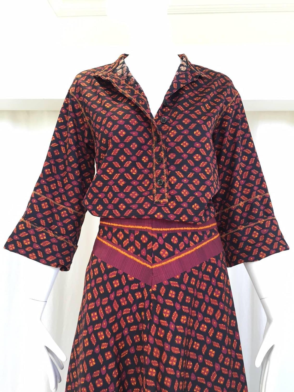 Vintage 1970s Anne Klein chic cotton burgundy and black ikat print blouse and maxi skirt ensemble. Blouse has 3/4 sleeve. 
 Fit Size Small - Medium
Blouse size: 6, Top is Size 6
Bust: 40"  20", Back collar to hem 25.5" Sleeve 11"